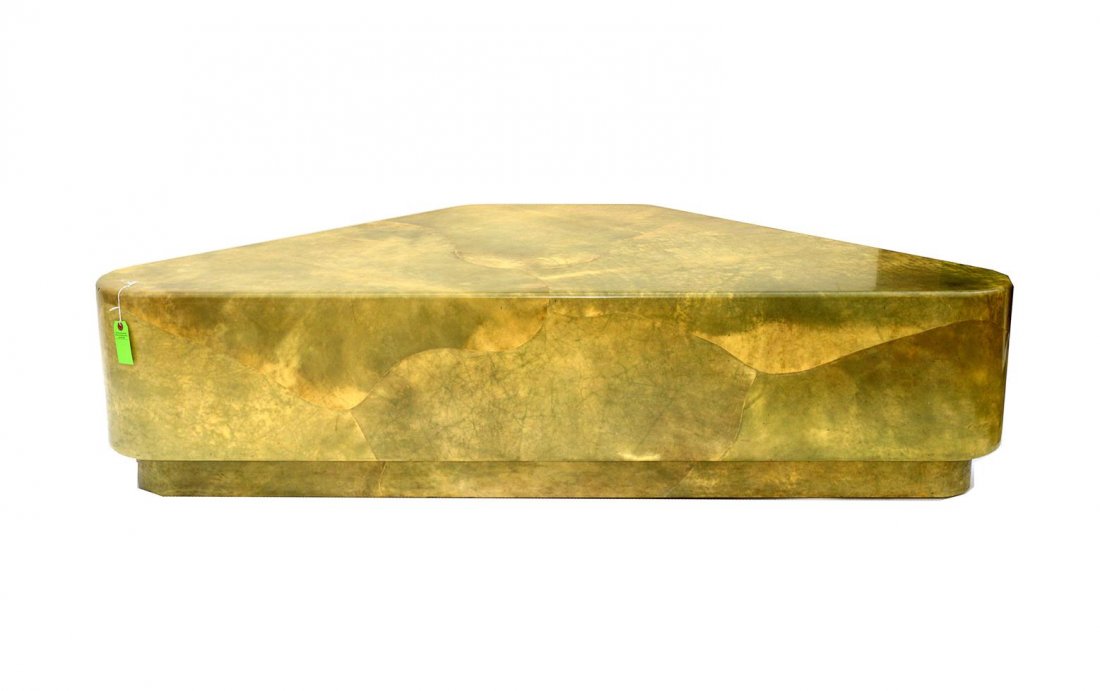 Karl Springer Style Triangular Cocktail Table: Lacquered jade tinted goatskin cocktail table on recessed base. Some scuffs and bruises with small area of cracking on top, otherwise complete. 68" x 32 1/4" D x 16 3/4".