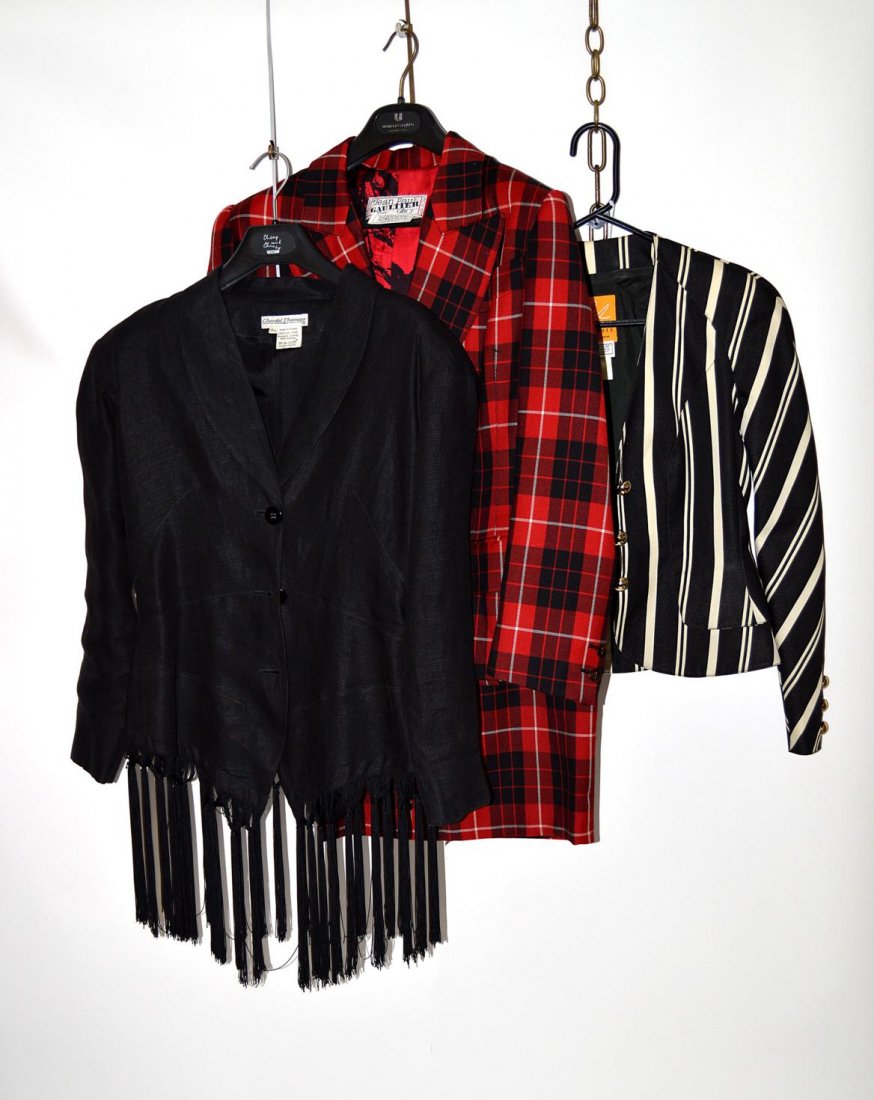 Mixed Lot, Designer Clothing: Plaid two-piece suit with skirt and jacket by Jean Paul Gaultier. Linen jacket with tassel by Chantal Thomass. Black and white striped jacket with gold buttons by Christian Lacroix. All with labels. G