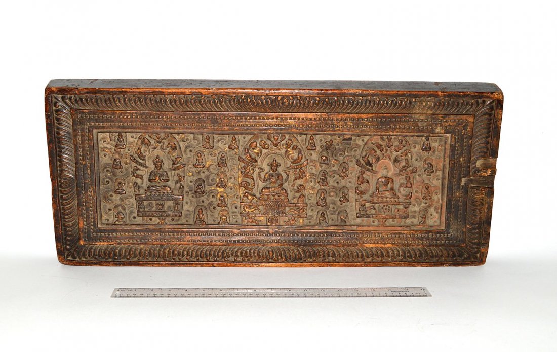 16th C. Asian Carved Walnut Panel: Parcel-tilt Buddhist panel. Losses and wear. 12" x 2 3/8" x 28".