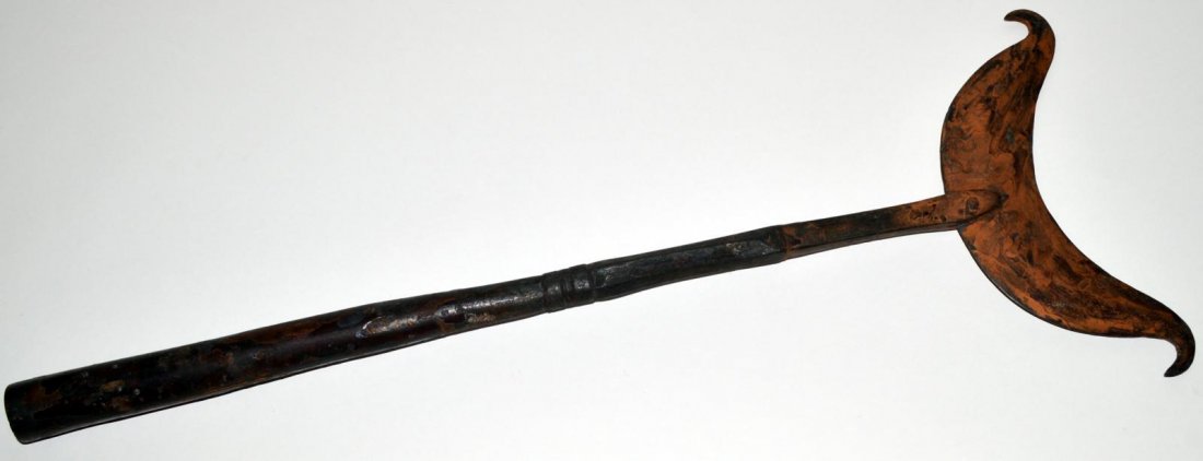 Unusual Wrought Iron Weapon: Comprises an elliptical blade with hooked ends on a fluted iron handle. 10 5/8" W x 27 3/8" H. In good condition.