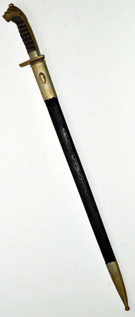 German Military Sword: Blade [22 3/4" L] stamped "P. D. Luneschloss Solingen". Bronze hand guard has been removed leaving a lion's head pommel with button top. Bears lizard grip. Overall: 28 7/8" L. Wear consistent with use