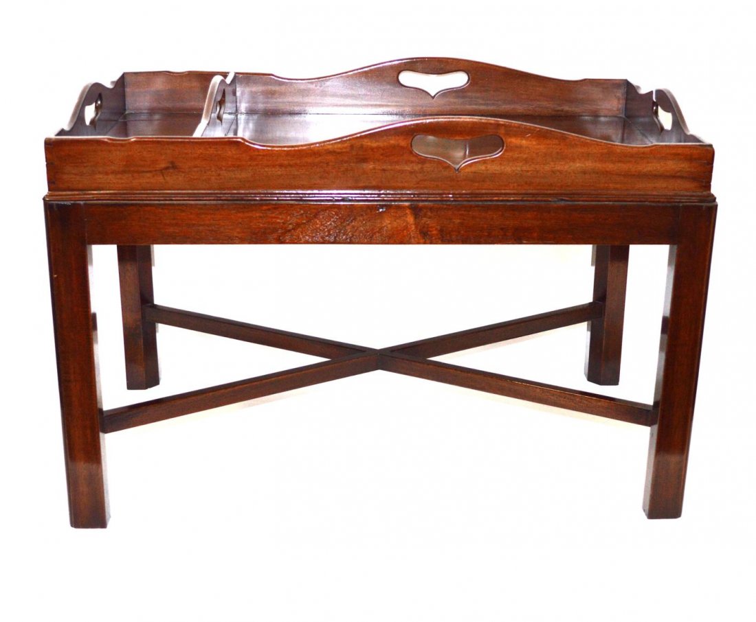 Butler Tray Top Table: Mahogany fitted butler tray top on a later matching base with cross stretcher. The tray having heart cut out handles. In good condition. 30 1/2" x 21" x 17 1/2" H.