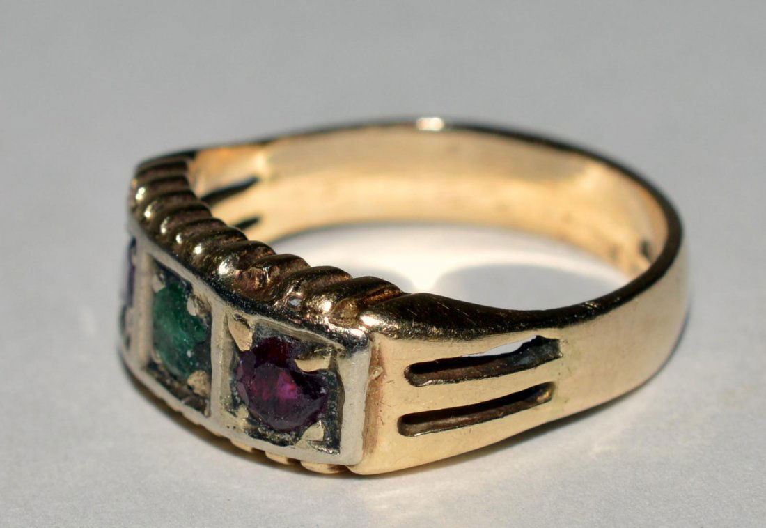 10k Gold Ring with Gemstones: Bears ruby, emerald, and garnet stones. 3.7 dwt inclusive.