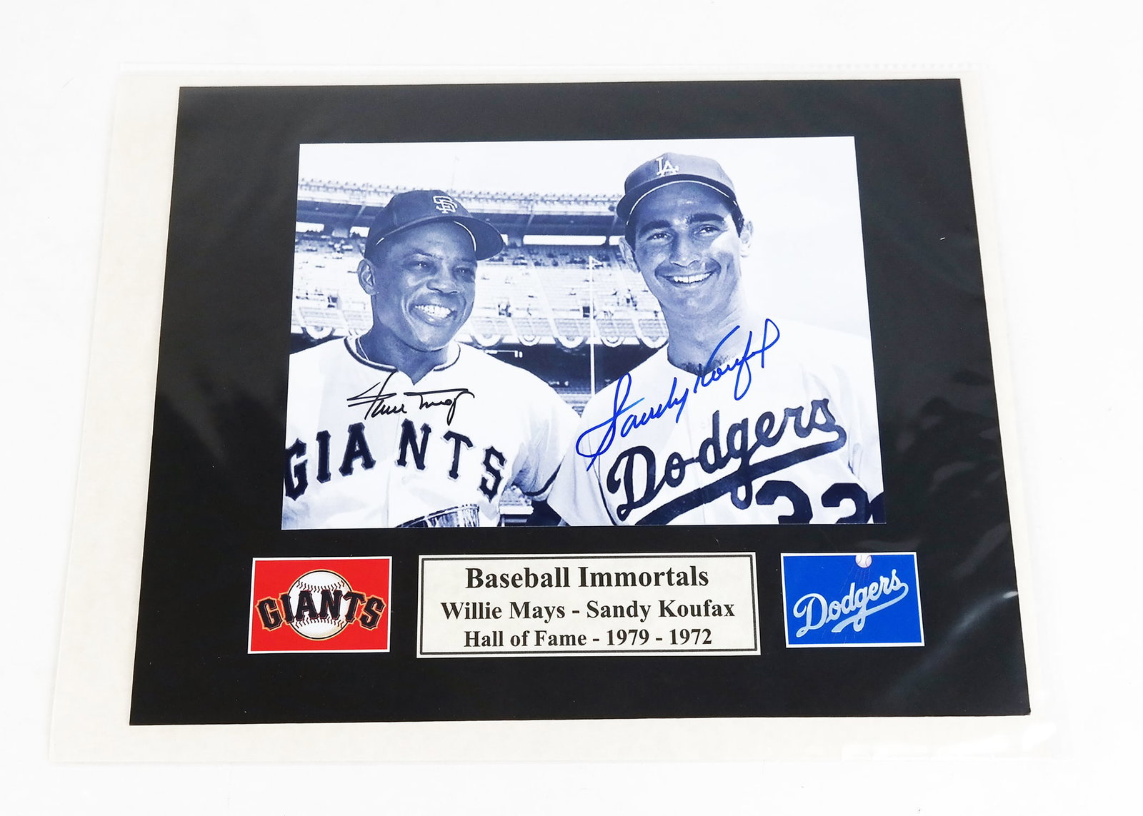 Willie Mays & Sandy Koufax Autographed Photo Reprint: Willie Mays and Sandy Koufax ("Baseball Immortals") autographed by both on digital reprint photo with Certificate of Authenticity included. [Photo: 5" H x 7" W; Mat: 8" H x 10" W].