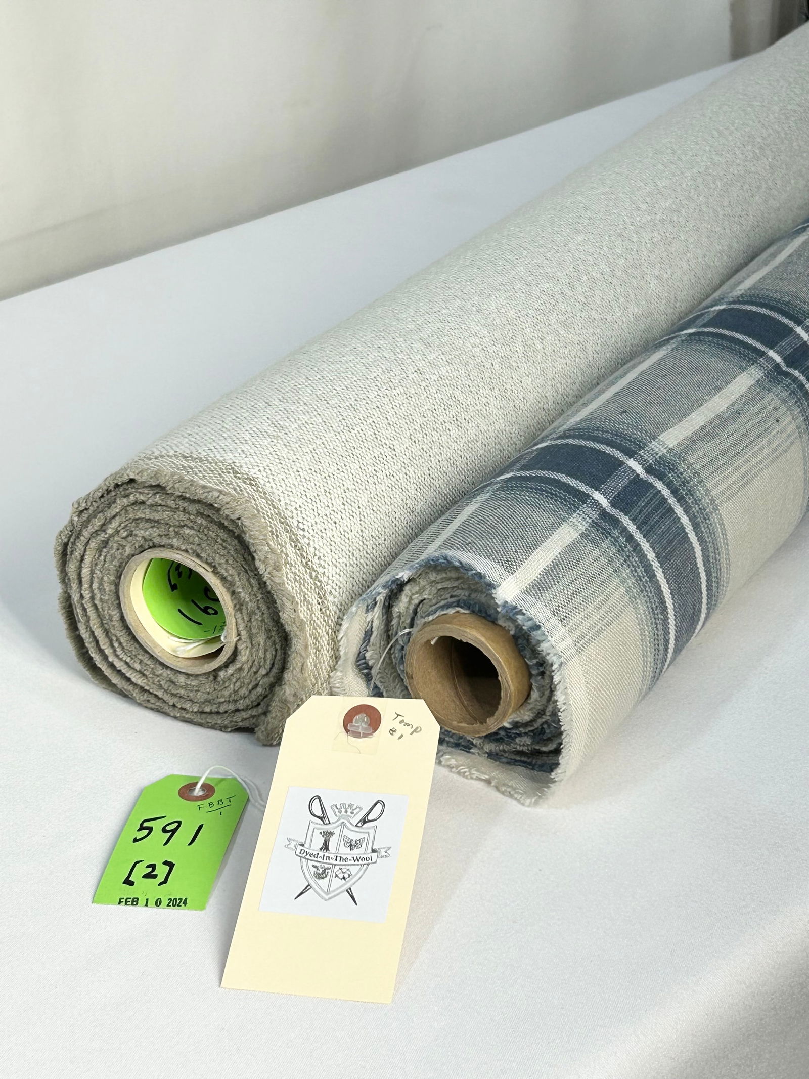 Colefax & Fowler Plaid and Casamance Texture Fabri: 1) 8 yards of Colefax & Fowler's "Lamorna Check" in Navy, # F4761-01, 55" width. The linen and cotton blend has a soft hand, fine for upholstery and windows. The blues, oyster and white colorway is in