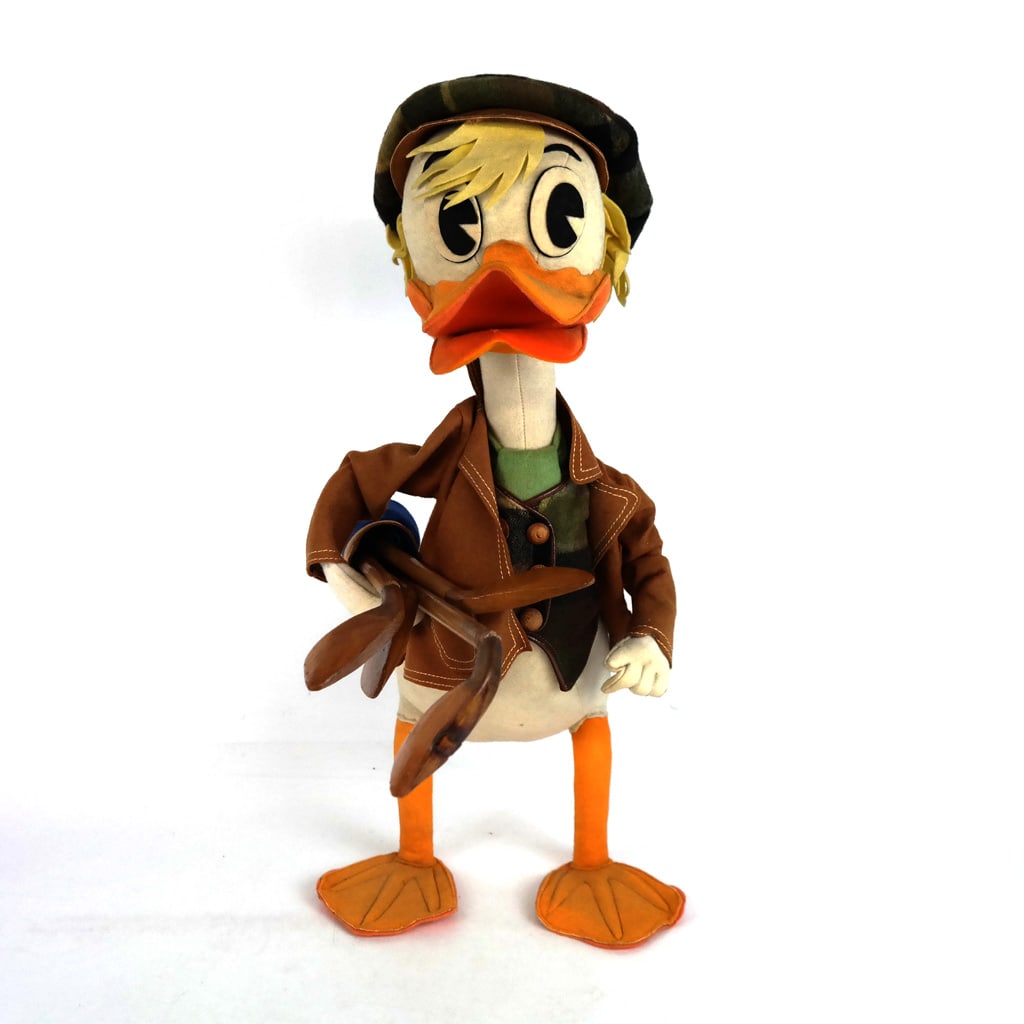 Lars Italian Felt Donald Duck: Lars Italian felt Donald Duck, mid-20th century, modeled as the iconic Disney character with golf clubs. Label not found. [20" H x 9 1/2" W x 8 1/2" D]. Scattered marks and wear; losses to clubs.