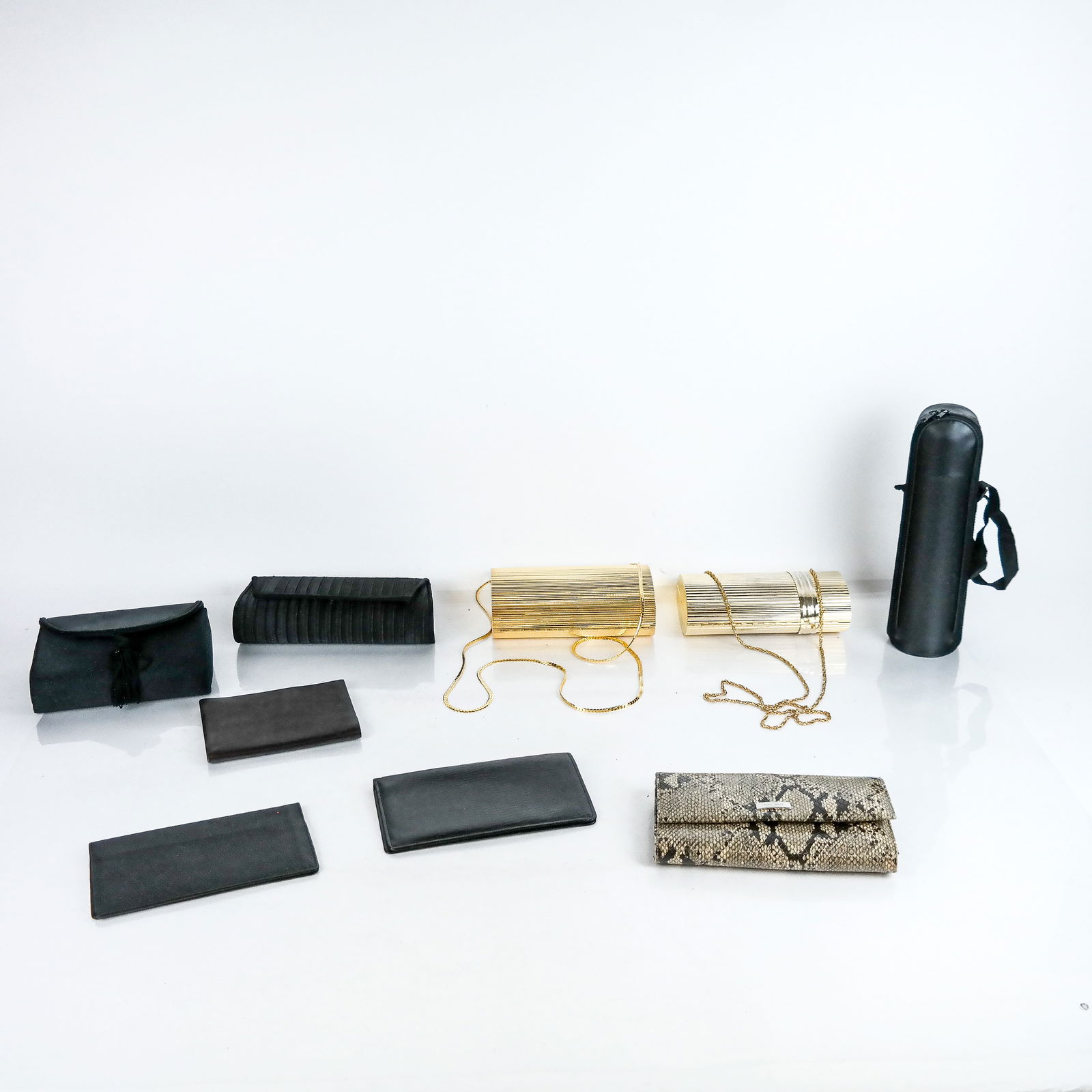 Group of Vintage Handbags & Wallets (8): Group of eight (8) vintage handbags and wallets, including four gilt metal and black satin convertible minaudiere clutch bags and four wallets, including Loewe and Nine West, with a bottle holder. [La