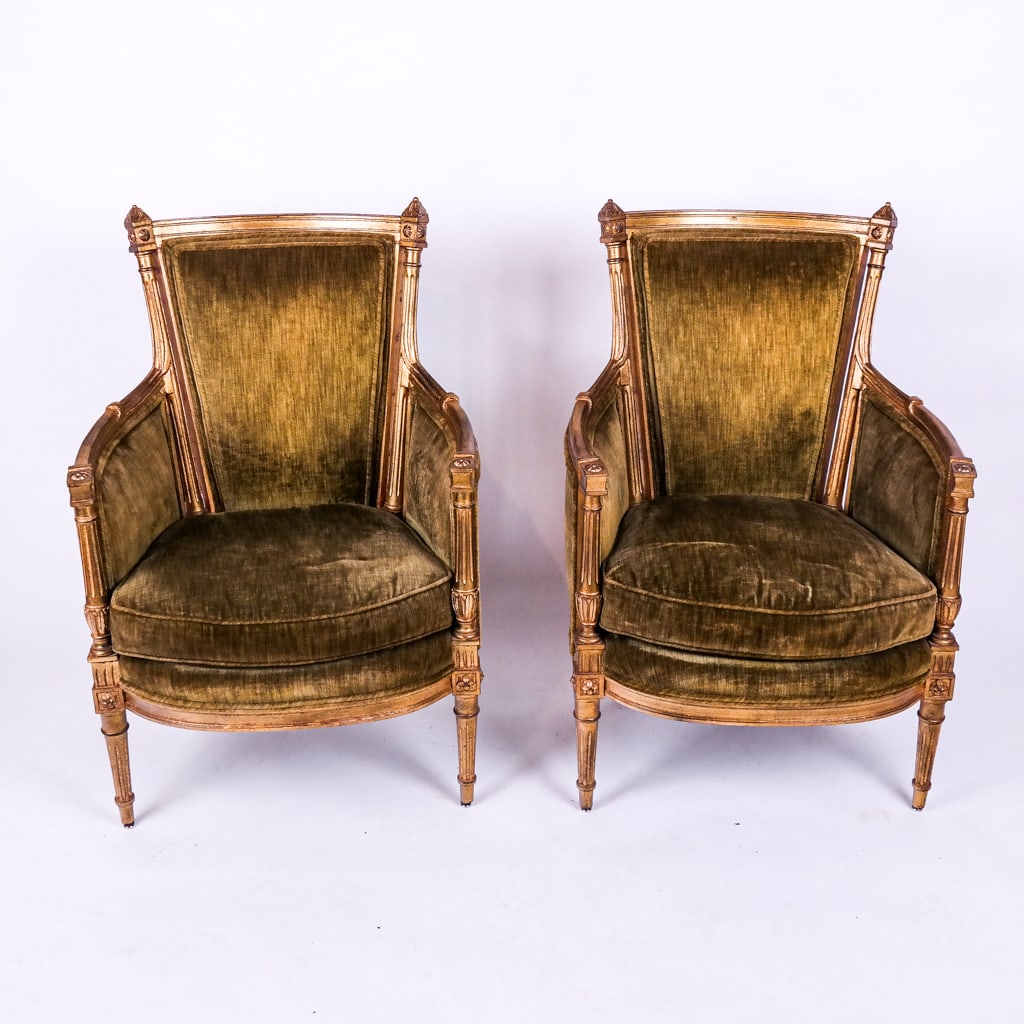 Pair of French-Style Gilt Armchairs: Pair of fruitwood Louis XVI-style armchairs (bergeres) with green upholstery, circa 1960. [38" H x 24" W x 19" D; 19 1/2" H to seat]. Need re-upholstering.