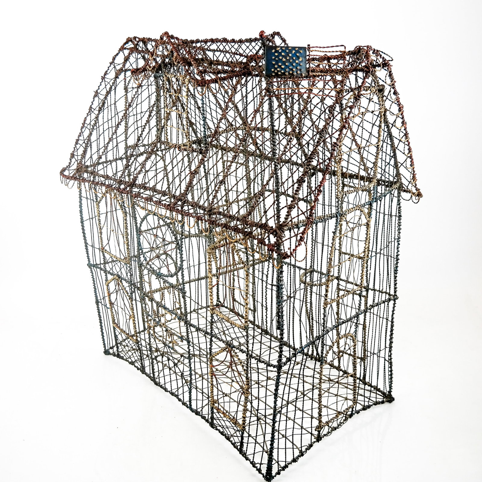 American Wire Frame House: Intricate twisted wire frame house with painted elements and American flag. [26" H x 24" W x 14" D]/