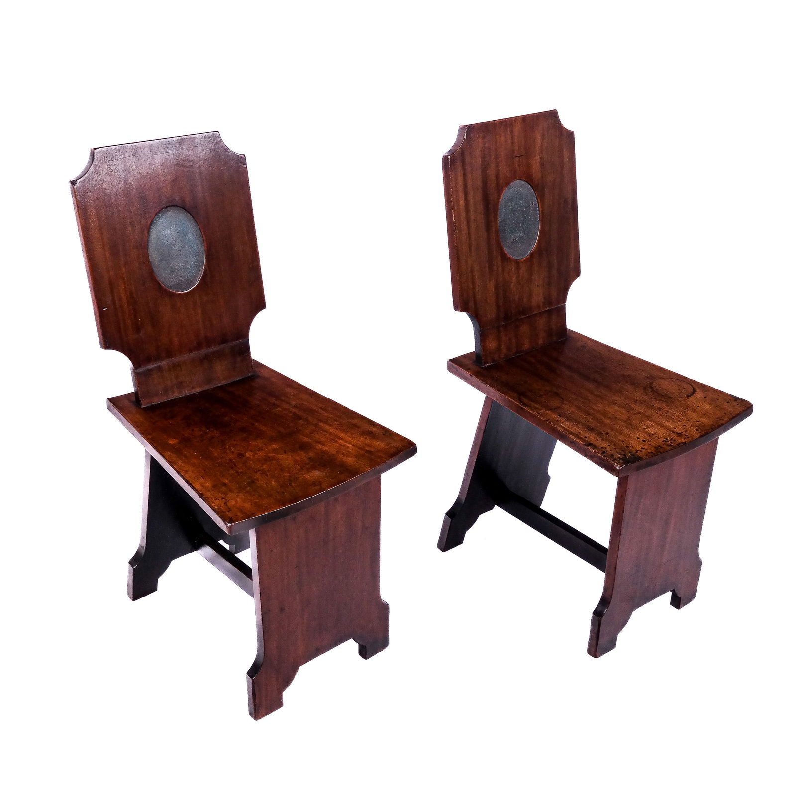Pair of Pilgrim Church-Style Side Chairs: Pair of church-style side chairs with flat back seats and legs, bearing remnants of an oval painted relief cut back. [35" H x 14" W x 22" D].