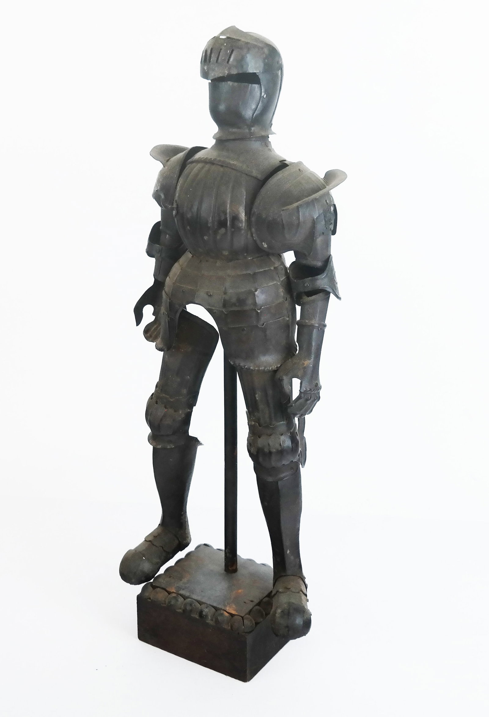 Miniature Metal Suit of Armor: Miniature metal suit of armor on stand and plinth base. [Overall: 17 3/4" H x 6 1/2" W x 4 1/2" D]. Residue, oxidation, dents and wear.