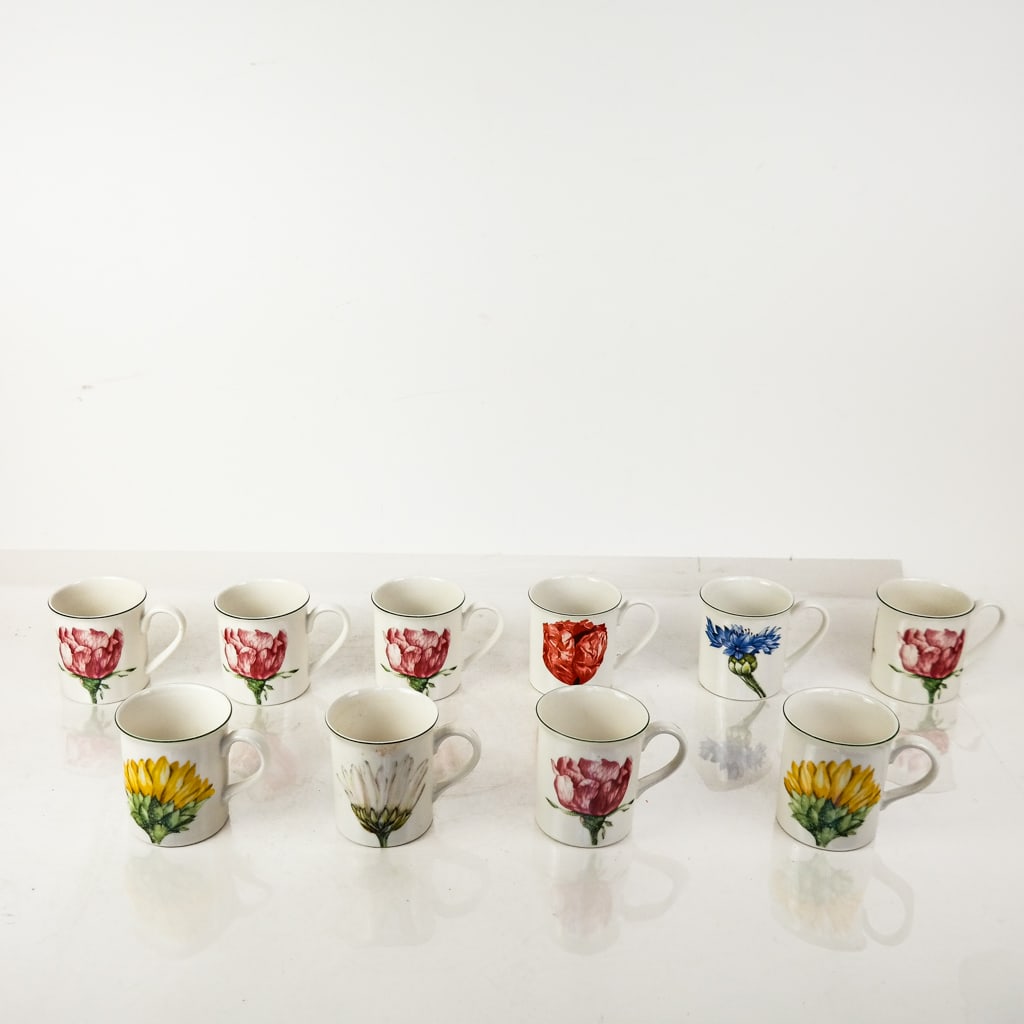 Villeroy & Boch Floral Porcelain Mugs (10): Ten (10) Villeroy & Boch floral porcelain mugs, of various heights, marked to bases. [Taller: 3 5/8" H]. Minor wear and light residue.