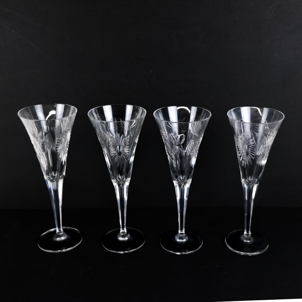Set of Four Waterford Irish Crystal Wine Goblets: Set of four Waterford Irish crystal wine goblets, marked to base. [9 1/4" H x 3 1/2" Diam.]. One chipped to rim; scuffs and wear.