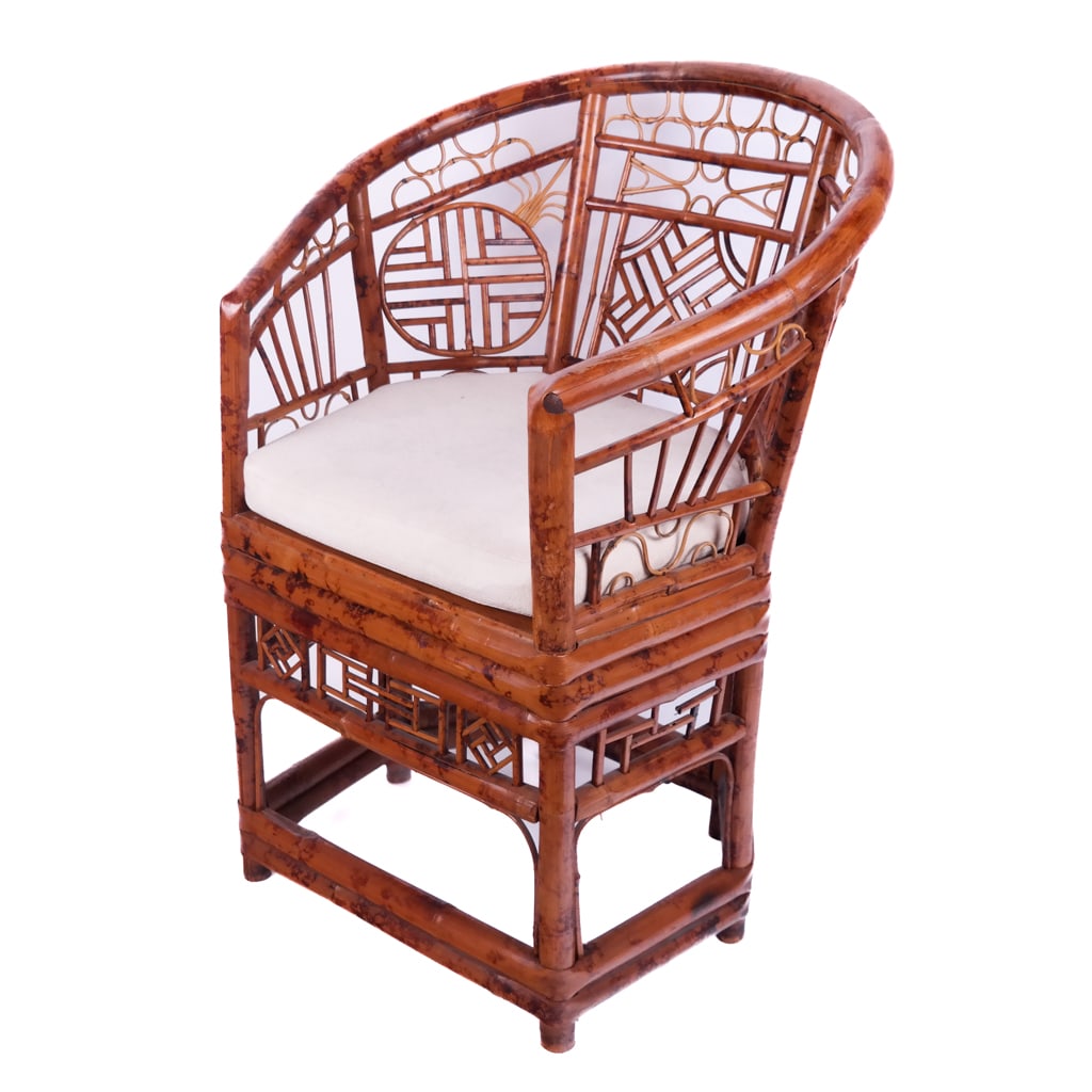 Brighton Pavilion Bamboo & Rattan Chair: 20th century Brighton Pavilion (England) bamboo & rattan bergere with a white slip cushion. 38" H x 25" W x 19" D; 19 1/2" H to seat (without cushion)].