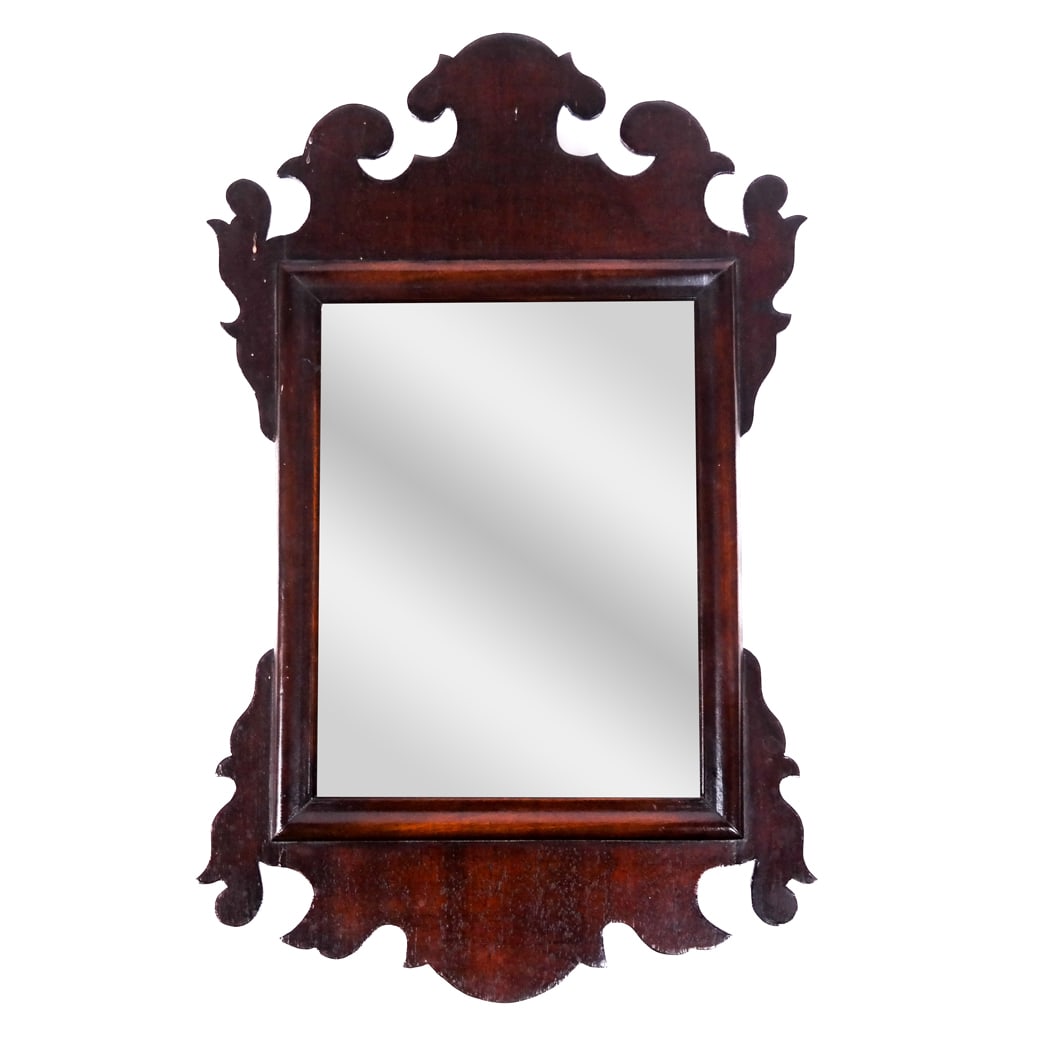 Antique Mahogany Fret Carved Mirror: Antique mahogany fret carved mirror, 19th century. [19 1/2" H x 12 1/4" W]. Scattered marks and wear.