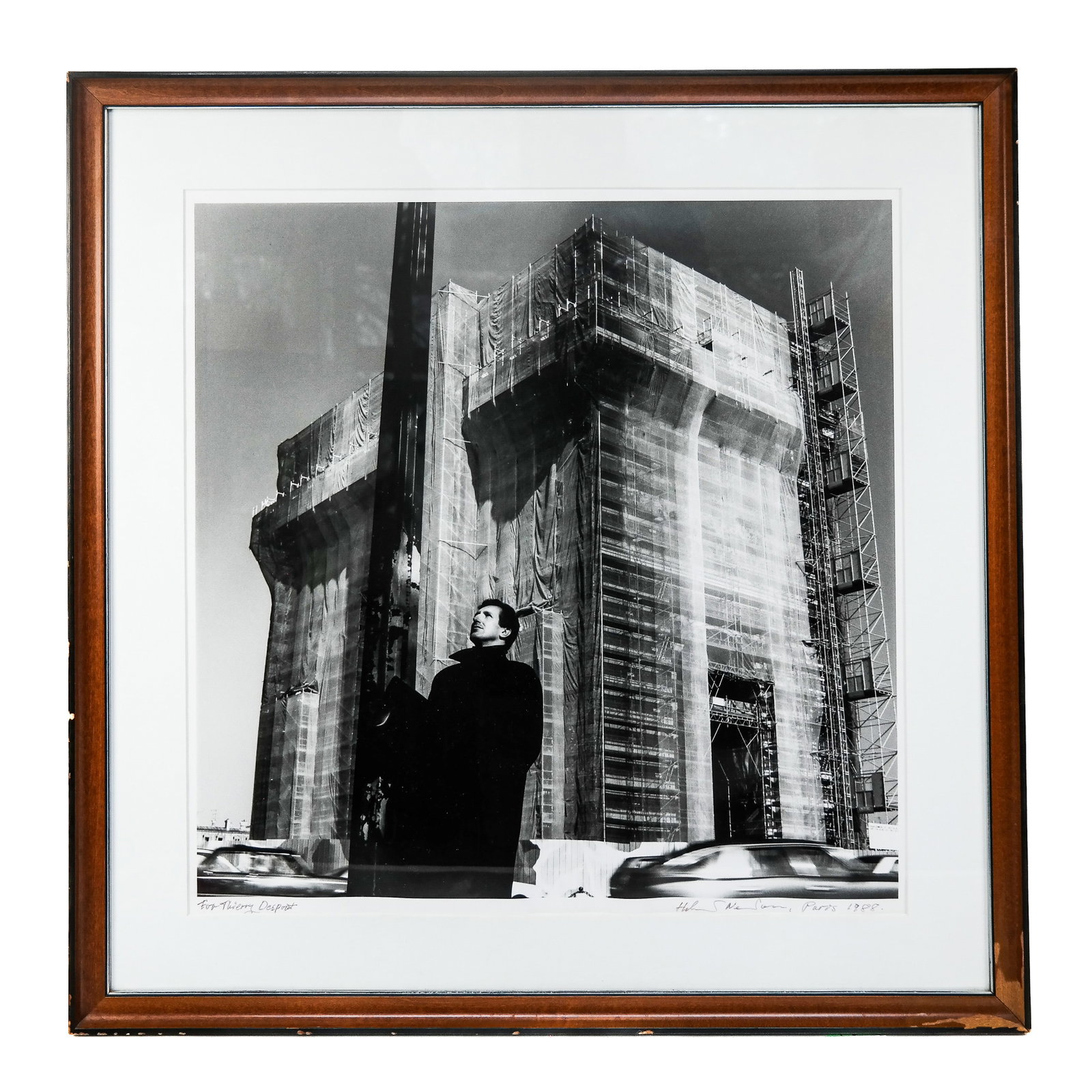 Black & White Photograph of Paris Building: Framed photograph of a Parisian building and a figure (possibly of Thierry Despont), signed by the artist, inscribed "To Thierry Despont". Provenance: From the Collection of renowned architect and des