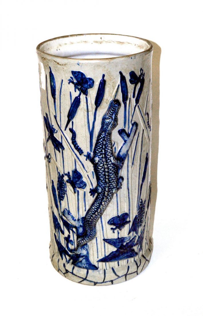 Aesthetic Movement Blue & White Umbrella Stand: Glazed ceramic with pussy willow, alligator, and insect motif. 9 1/2" Dia x 20 1/4" H. In good condition.