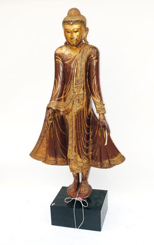 Life Size Buddha Figure: Gilt and painted figure in a decorated and jeweled style robe.