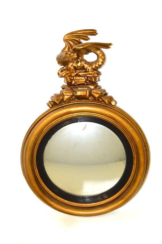 Dragon Pediment Convex Mirror: Circular mirror contained in a gold-tone carved wood frame with dragon pediment. 22"W x 6"D x 31"H. Previously repaired, needs restoration.