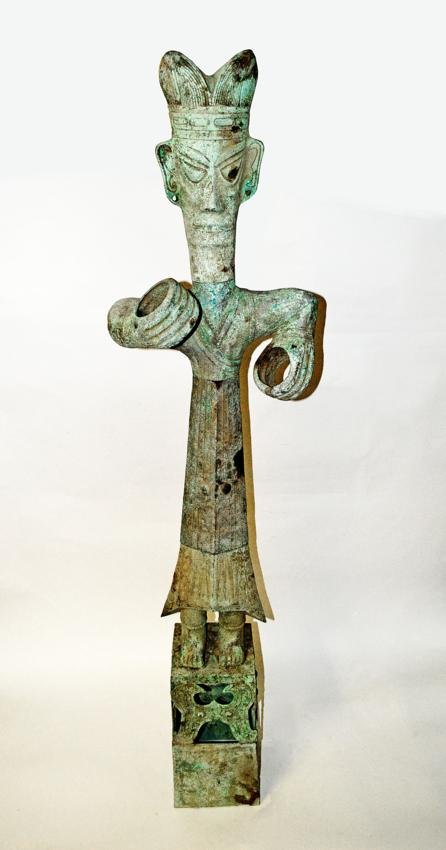 Polynesian Bronze Deity Sculpture: Full length standing figure w/crown. Missing unknown elements in hands and ears. Good condition. 15 1/2"W x 8 3/4"D x 63 1/2"H.