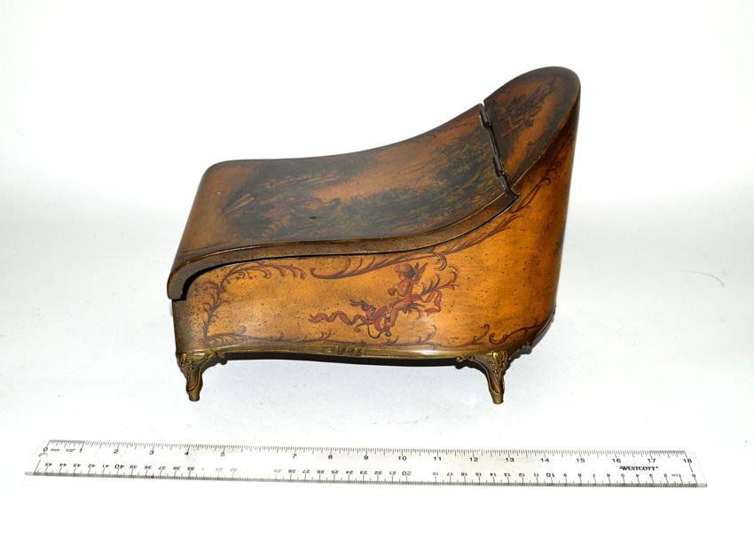 Scenic Chaise Form Box: Decorated with figures in a garden, contemporary. 6 1/2" x 11" x 9".