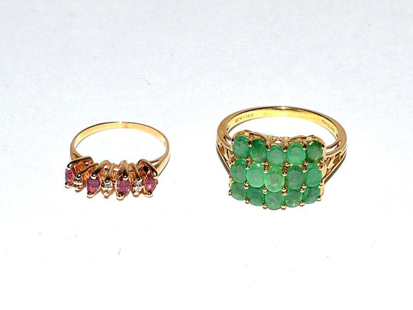 Two Ladies' 14k Gold Rings, Emerald & Rubies: Comprises an emerald ring with 15 stones. [2.3 ozt inclusive.] Accompanied by a ruby ring with four stone and diamond accents. [1.1 dwt.]