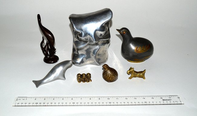 Assorted Metal Animal Figures [7]: Large pewter abstract owl [7 1/2" H] and a small seal, both signed "Hoselton Canada." Accompanied by mixed metal duck box, three brass figures, and one standing crane figure. Seven total. As is.