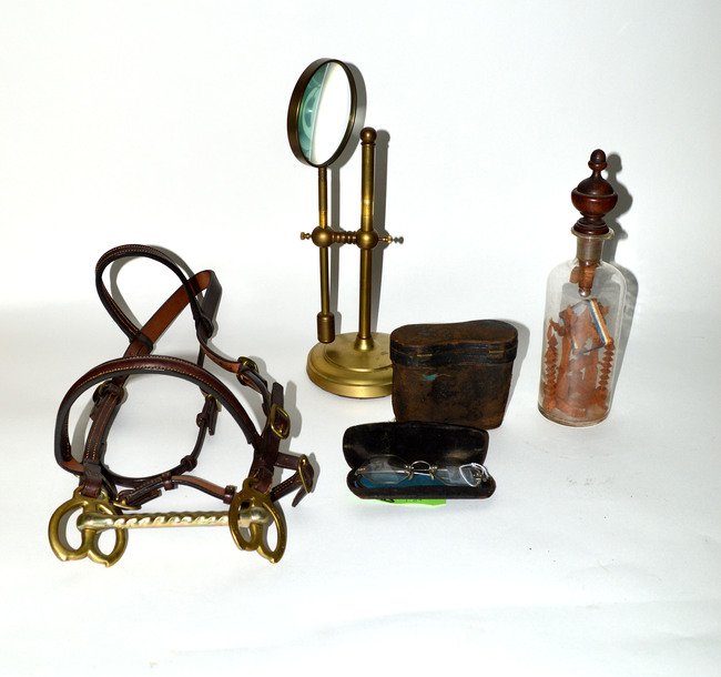 Assorted Curiosities [5]: Brass table top magnifying glass, folk art in a bottle, small bridle, antique glasses, and binoculars. All as is.