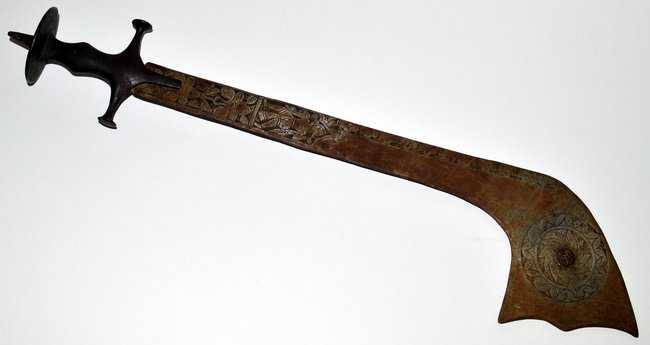 North Indian Kora Sword: Features curved steel blade, 21" L with Niello decoration. Bears iron handle with circular pommel and pointed button. As is, needs cleaning, otherwise complete. Overall: 28" L.
