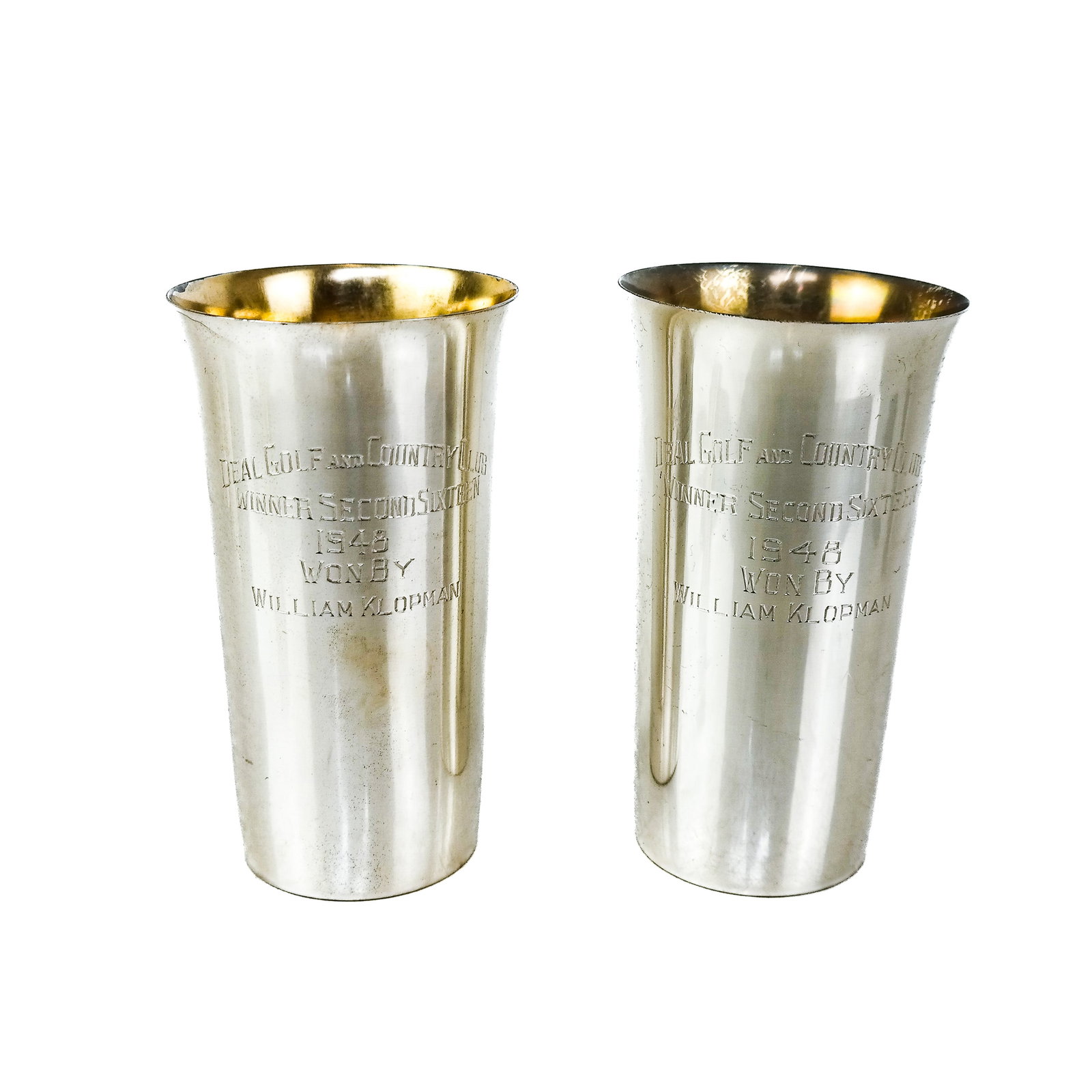 Pair of Sterling Silver Deal Golf Highboy Glasses: A pair of sterling silver Deal Golf and Country Club presentation highboy glasses. Manufactured by Fisher. Both with engraved dedications. [5 1/4" x 3" Diameter]. (Total weight: 9.25 ozt.). Provenance