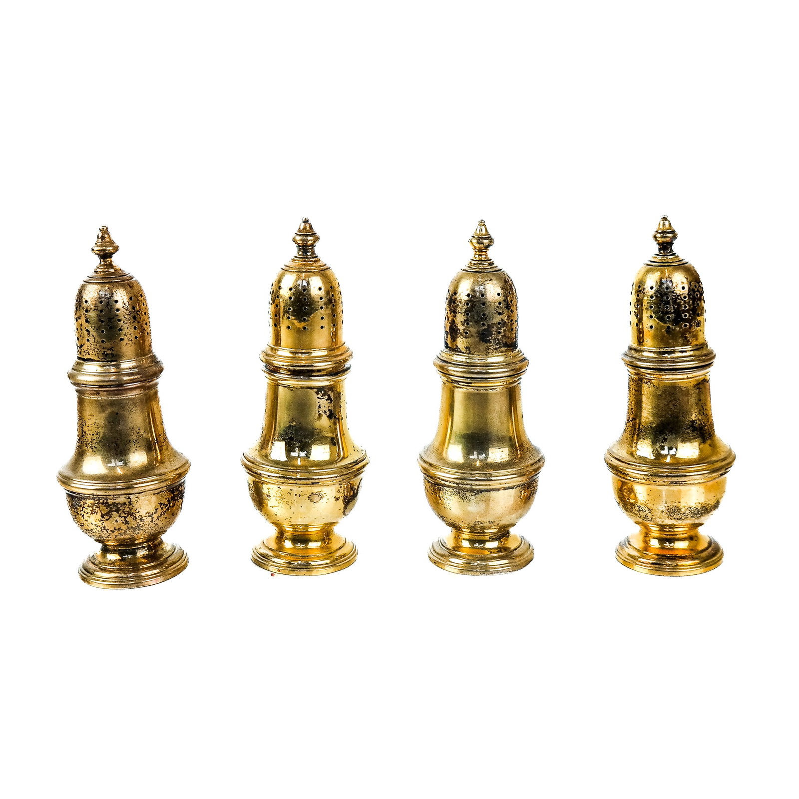 Set of 4 Tiffany & Co. Makers S/S Vermeil Shakers: A set of four Tiffany & Co. Makers sterling silver vermeil shakers. [4 3/8" x 1 5/8" Diameter]. (8.8 ozt.). Provenance: From the Estate of Baroness Gabriele Langer von Langendorff.