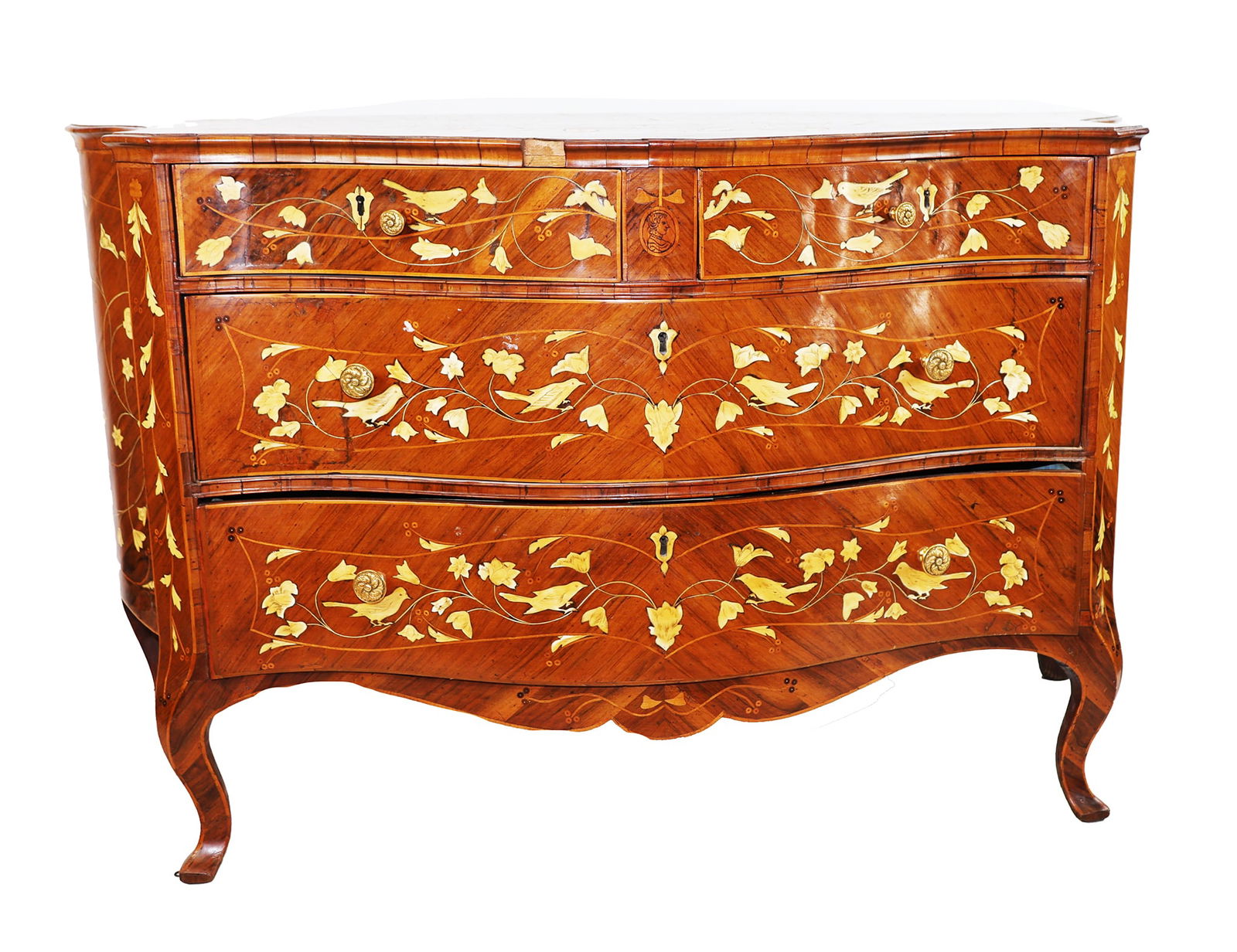 Continental Bone Inlaid Four Drawer Commode: Late 18th/early 19th century, probably Tyrolean or Swiss, a tulip wood and bone inlaid four drawer commode of serpentine-outline, the top having an extensively inlaid central heart with birds, and bir