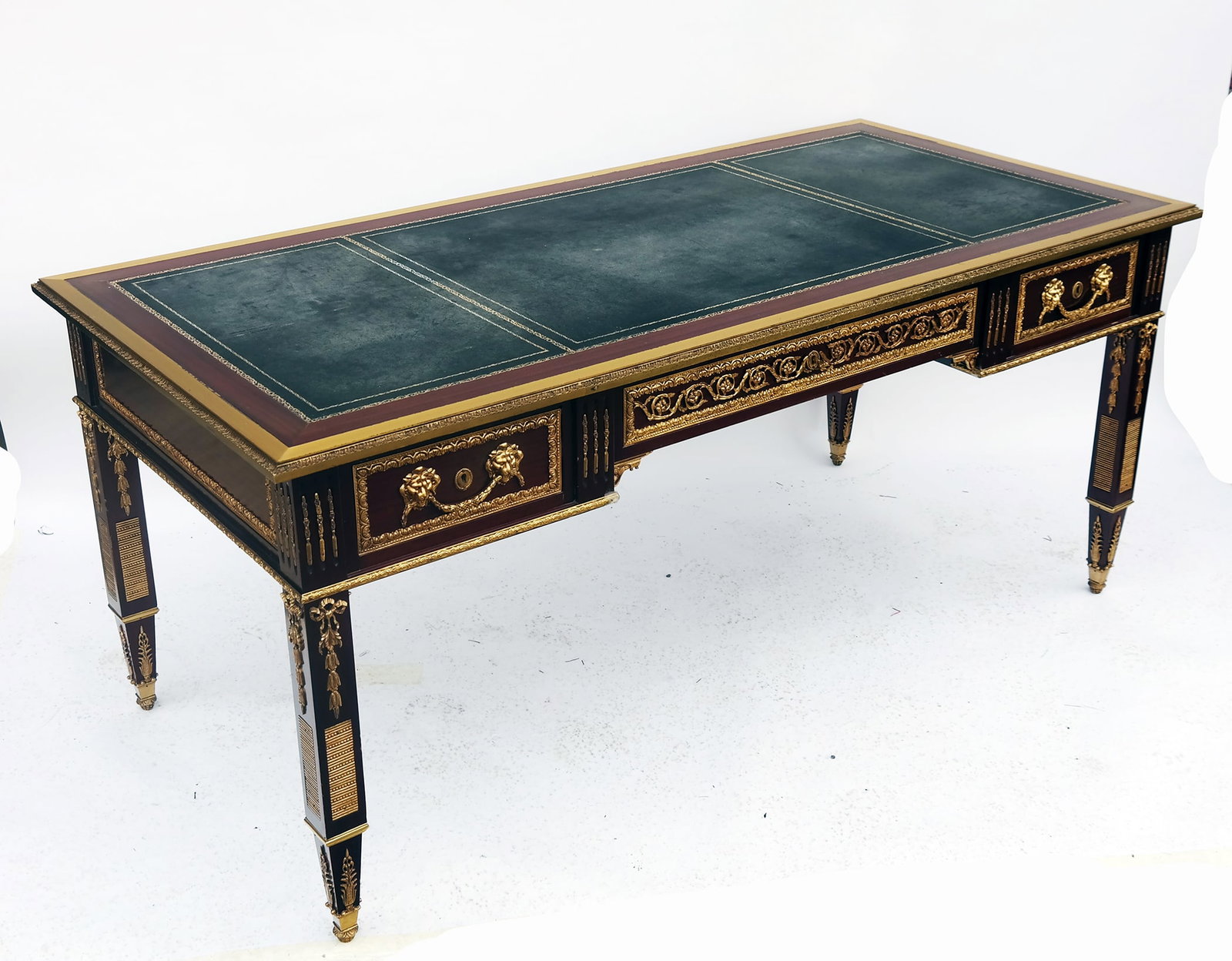 Louis XVI-Style Bronze Mounted Bureau Plat - Desk: A Louis XVI-style rosewood bureau plat - desk with ornate bronze mounted details throughout and leather writing top, in the style of Reisner. [31 1/2" H x 71 1/2" W x 35" D]. Provenance: From the Esta