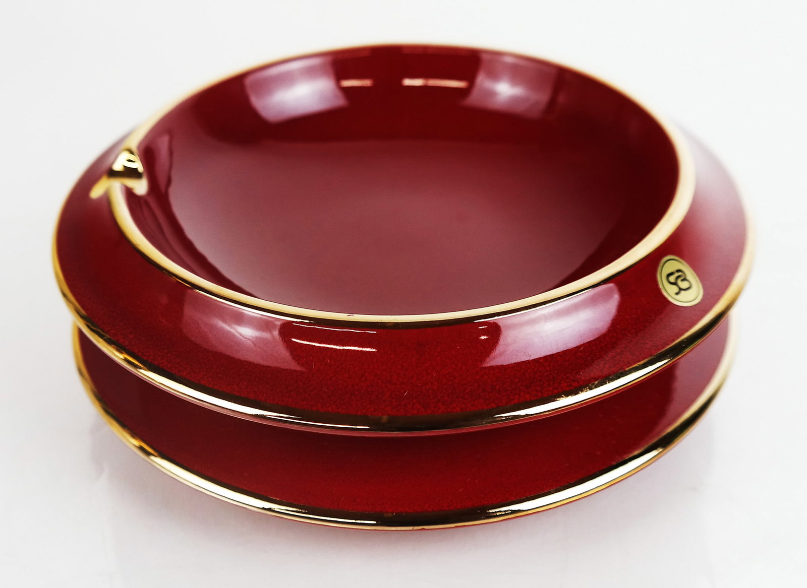 Mid-Century Modern Italian SCB Ceramic Ashtray: A Mid-Century Modern Italian "SCB" red ceramic ashtray. [7 1/2" Diam.]. Provenance: From the Estate of Baroness Gabriele Langer von Langendorff.