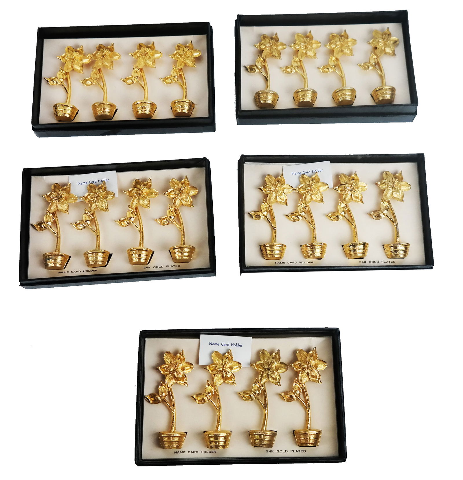 Collection of 20 Gold Leaf Place Card Holders: Five sets of four gold leaf place card holders shaped as potted flowers in boxes. 20 pieces. Provenance: From the Estate of Baroness Gabriele Langer von Langendorff.