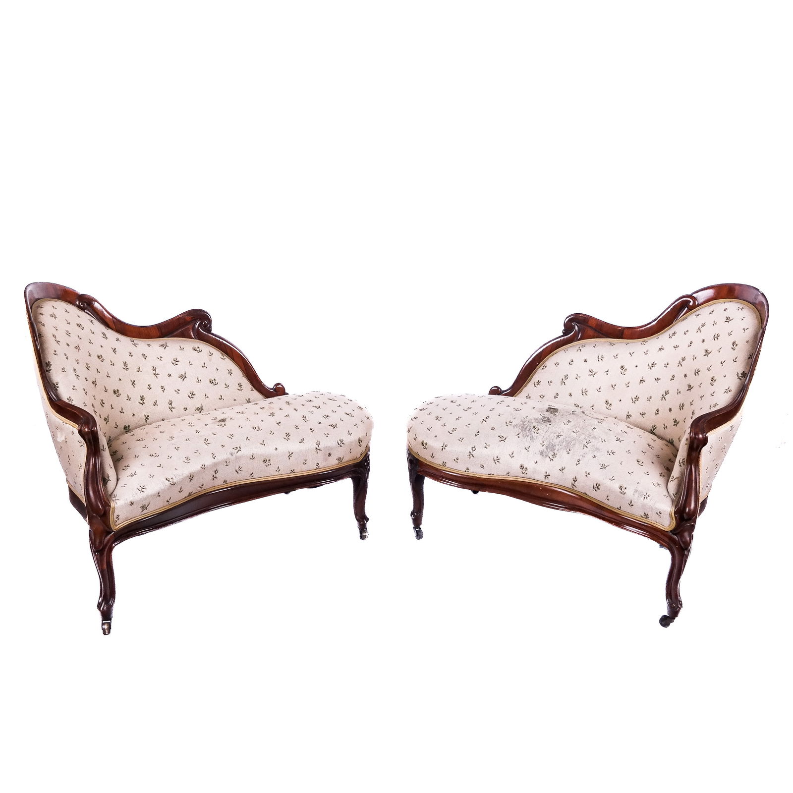 Pair 19th C. Belter Style Petite Divans: Pair of antique Victorian carved mahogany upholstered small recamiers - divans with thin sloping crest rails, in the manner of John Henry Belter. [34" H x 47" W x 26" D].
