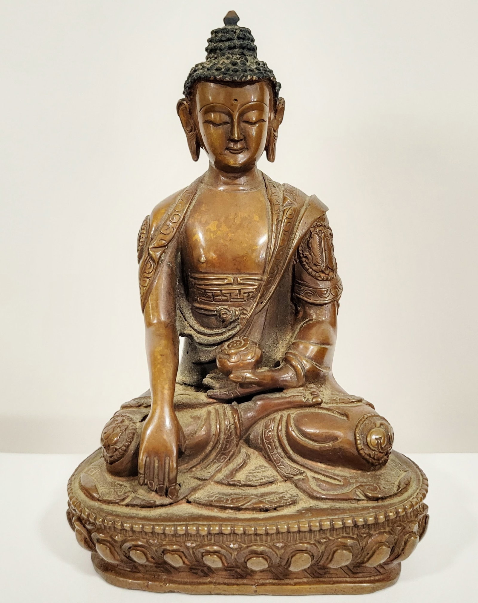 Bronze Seated Buddha: Bronze seated Buddha, possibly Nepalese. [5 3/4" H x 4" W x 2 1/2" D]. In good condition.