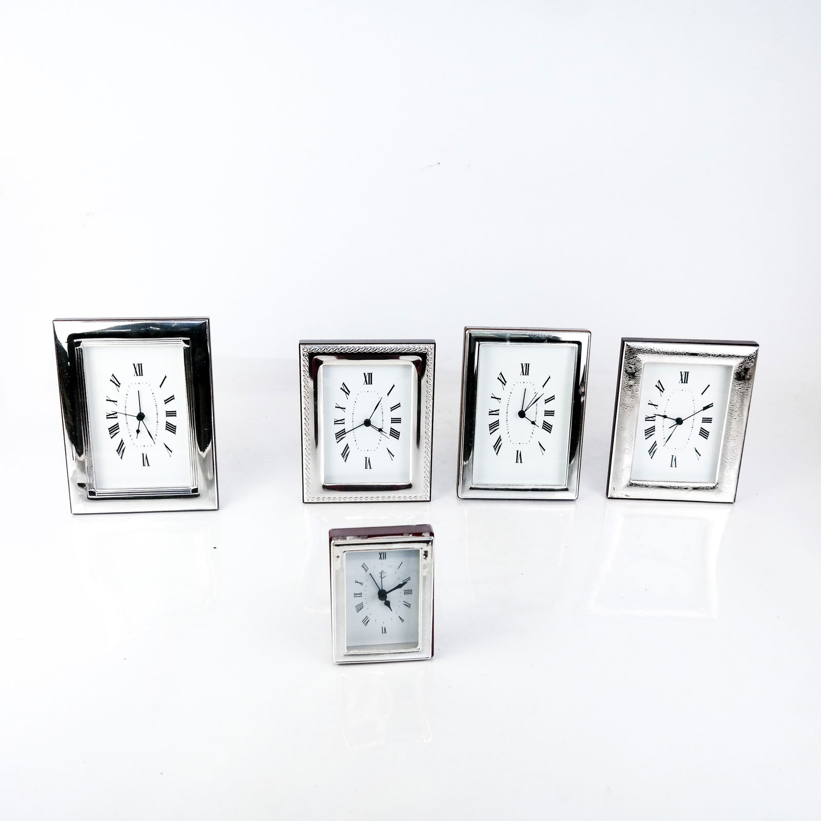 Group of Silver Laminated Table Clocks (1 of 9)