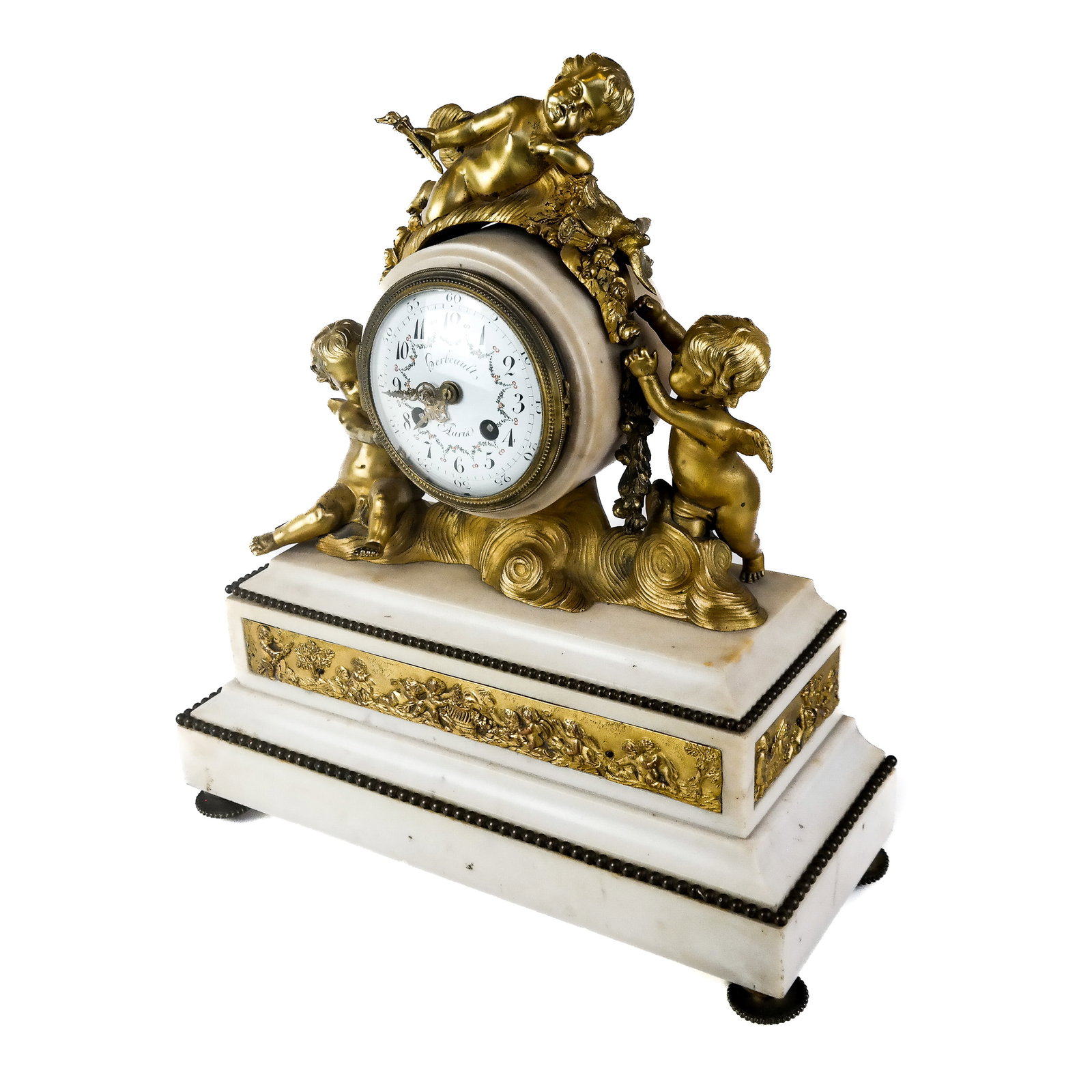 Gerbault Bronze Mounted Mantel Clock: A bronze mounted mantel clock having dancing Cupids atop with two step marble plinths and bronze dore reliefs all around, on bronze feet. Having a white porcelain dial, signed Gerbault. [17" H x 14" W