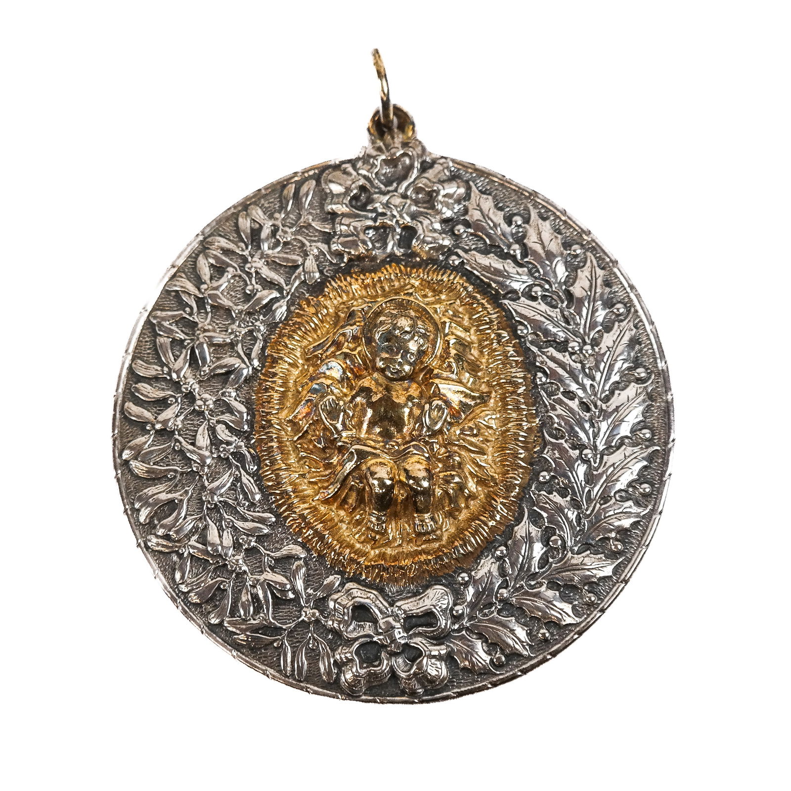 Buccellati Sterling Silver Pendant: Buccellati sterling silver pendant, all repousse designs of vermeil center putti with border of garland and ribbon. 54 grams. [3 3/4" Diam.].
