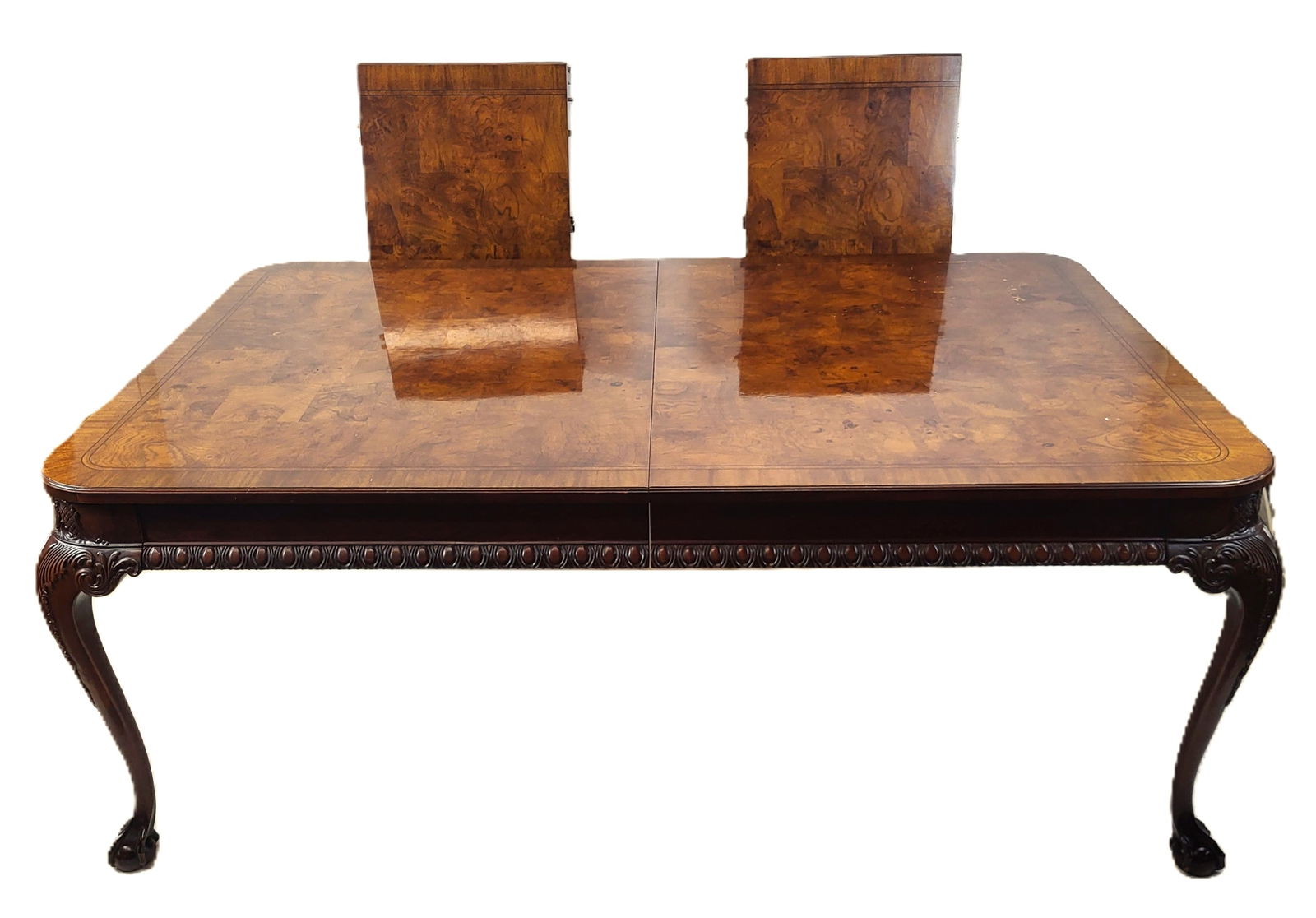 Large Vintage Carved Dining Table: Large vintage English Chippendale-style dining table on ball and claw feet, with two leaves. Table is 117" long with leaves inserted. [30 1/2" H x 78" W x 48" D; Leaves (x2) 19 1/2" W x 48" D]. In goo