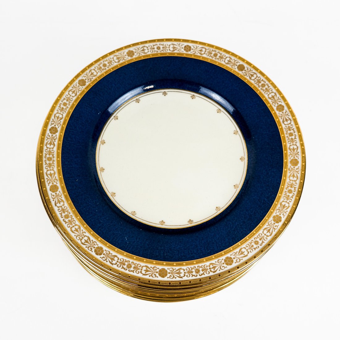 Mintons for Davis Collamore Plates (12): Twelve (12) Mintons for Davis Collamore luncheon plates, with bone and gilt-decorated border, cobalt modeled check and bone center. [8 3/4" Diam.].