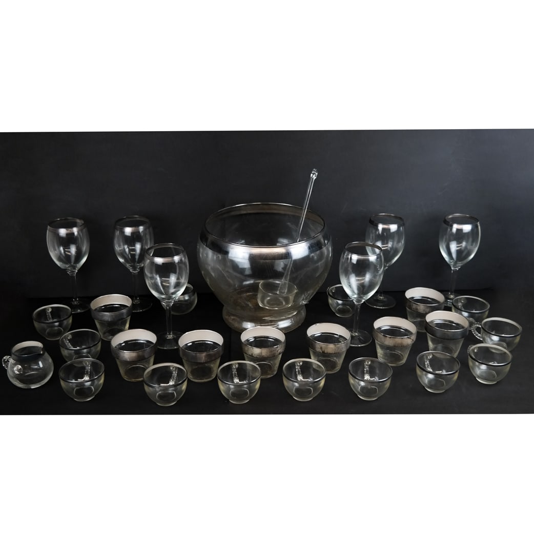 Silver and Glass Cocktail Set (28 Pcs): Silver and glass cocktail set, mid-20th century, comprising a punch bowl and cups, wine ladle, goblets, old-fashioned glasses and other items, together with original manual. Not weighable. 28 pieces.