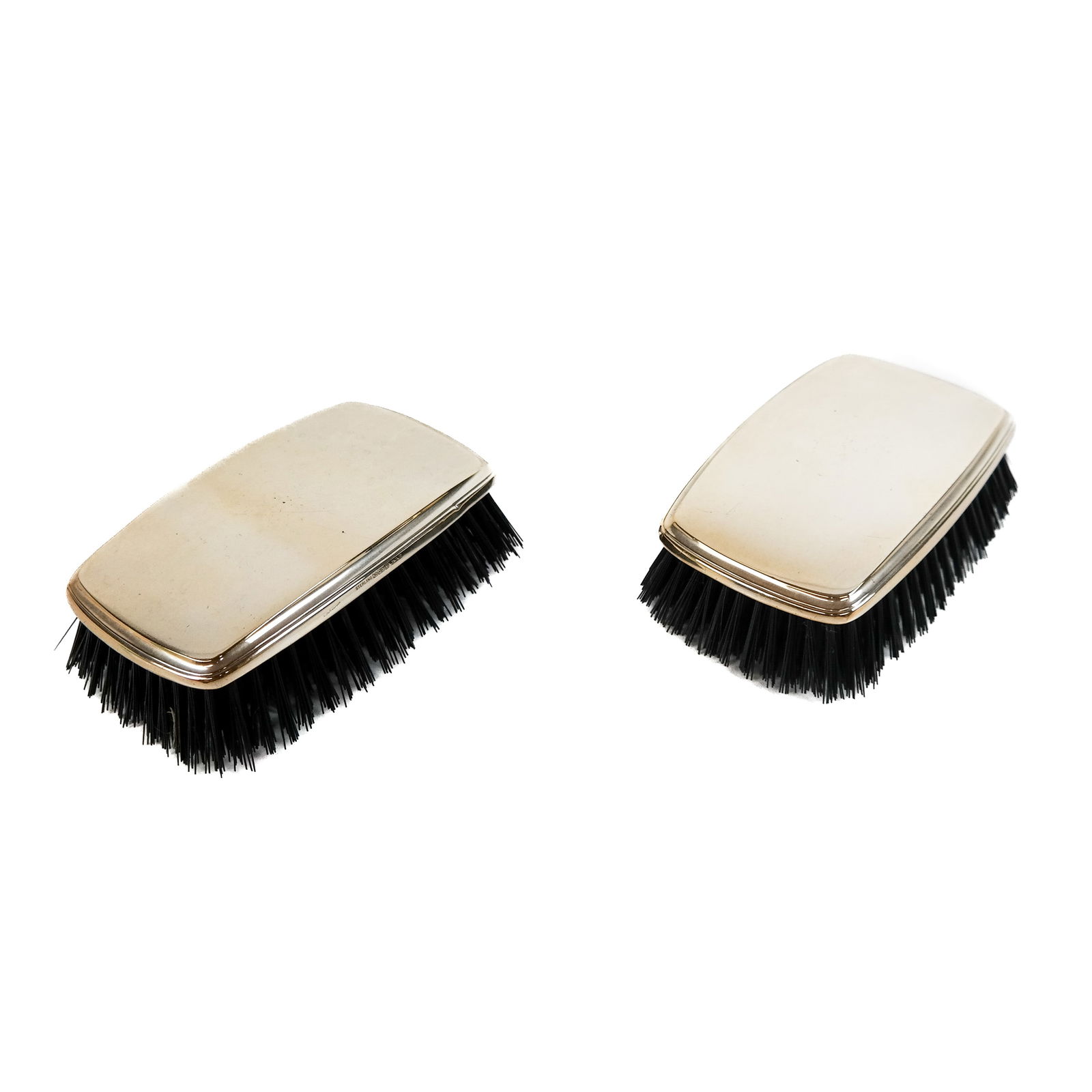 Pair of Reed & Barton Silver-Mounted Brushes: Pair of Reed & Barton sterling silver-mounted brushes, made for Cartier, not monogrammed. Provenance: From the Estate of Baroness Gabriele Langer von Langendorff. [3" x 5"].