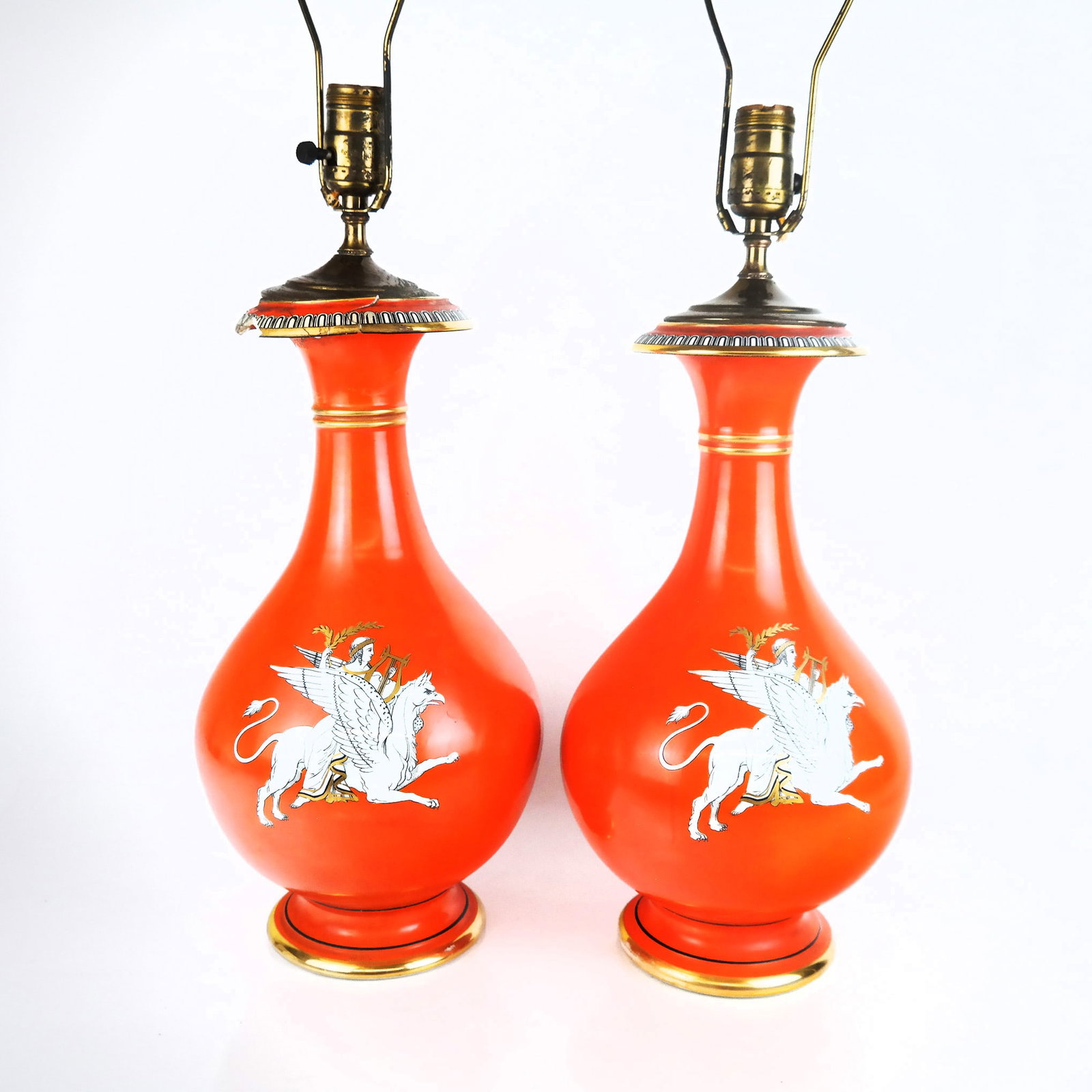 Paris Porcelain Grecian-Style Lamps (2): Pair of orange patina vases mounted as lamps, each with allegorical decorations of horses and riders; not drilled. [Vase only: 4 1/2" H; 19 1/2" H to socket]. One rim restored.