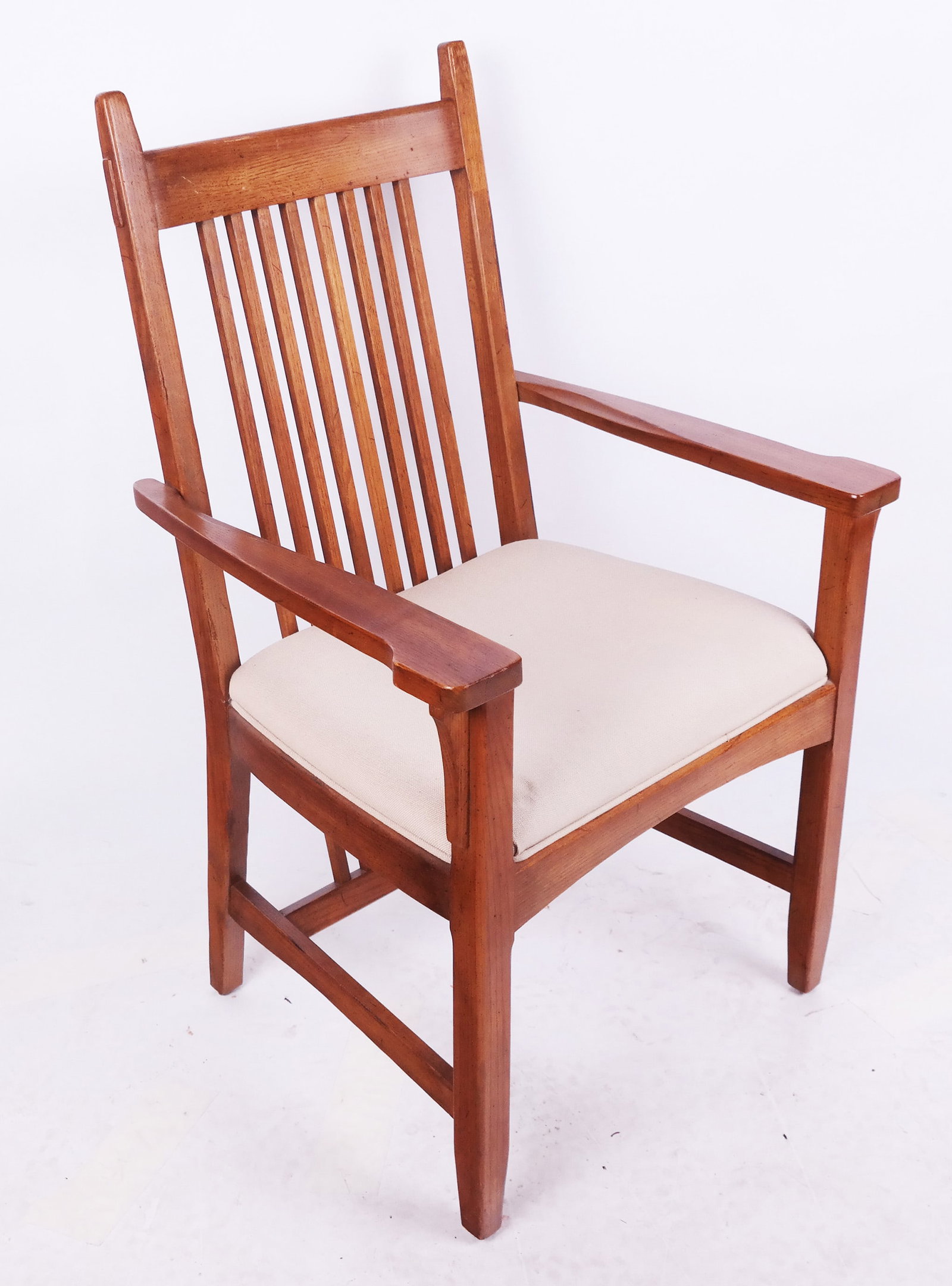 Stickley-Style Oak Armchair: Stickley-style oak armchair having straight slat back (all the way down to the stretcher), made by Lane. [40" H x 25" W x 25" D].