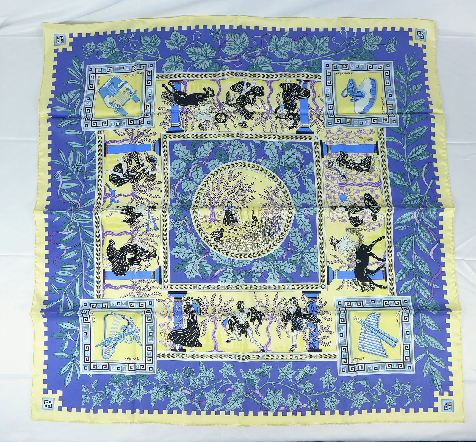 Vintage Hermes Paris Silk Scarf "Musique des Dieux" with box: This is a classic 90cm Carre Hermes Silk Scarf made in Paris dating from the late 80's or 90's. Titled "Musique des Dieux" and is decorated with a Greek figural and musical instrument design. It was D