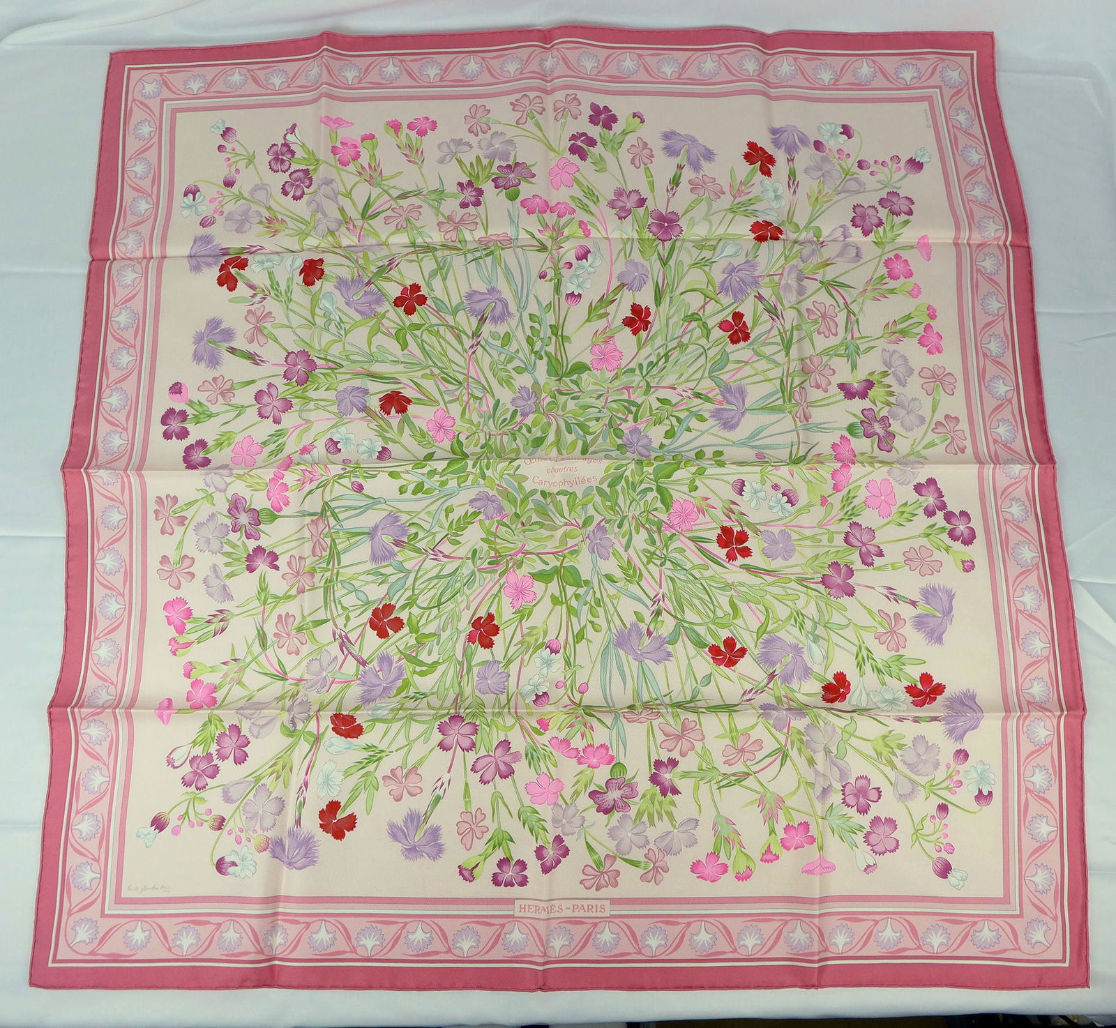Vintage Hermes Paris Silk Scarf "Oeillets Sauvages et Autres Caryophyllees" with box: This is a classic 90cm Carre Hermes Silk Scarf made in Paris dating from the late 80's or 90's. Titled "Oeillets Sauvages et Autres Caryophyllees" and is decorated with a field of blooming flowers. It
