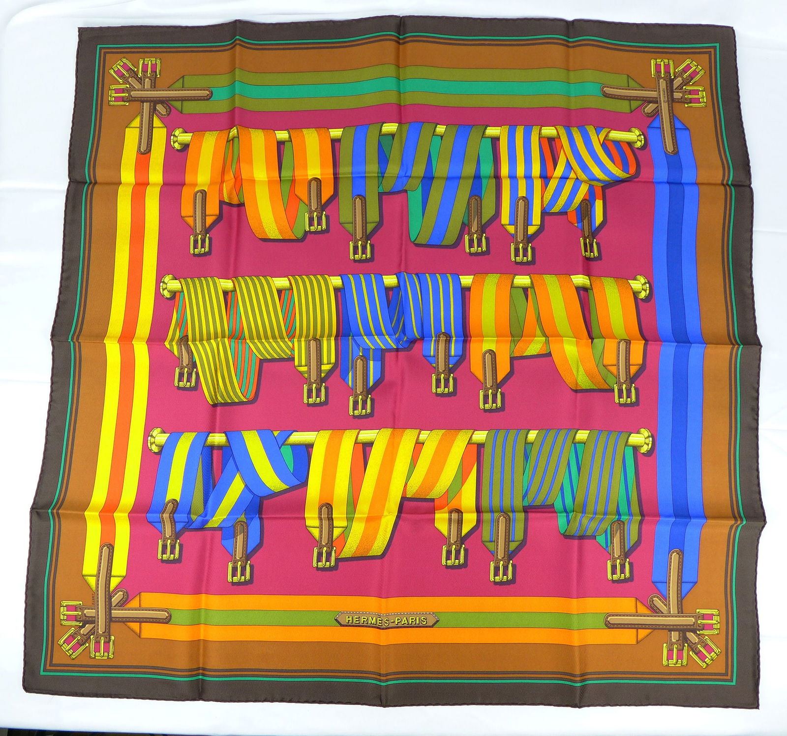 Vintage Hermes Paris Silk Scarf "Sangles" with box: This is a classic 90cm Carre Hermes Silk Scarf made in Paris dating from the late 80's or 90's. Titled "Sangles" and is decorated with group of multicolor hanging and draped equestrian belts buckles.