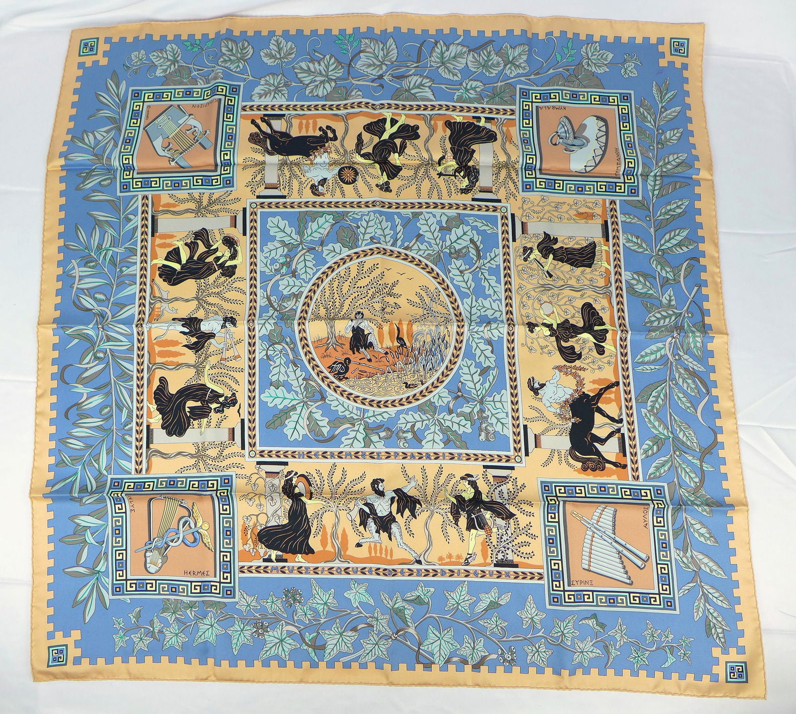 Vintage Hermes Paris Silk Scarf "Musique des Dieux" with box: This is a classic 90cm Carre Hermes Silk Scarf made in Paris dating from the late 80's or 90's. Titled "Musique des Dieux" and is decorated with a Greek figure and musical instrument design. It was De
